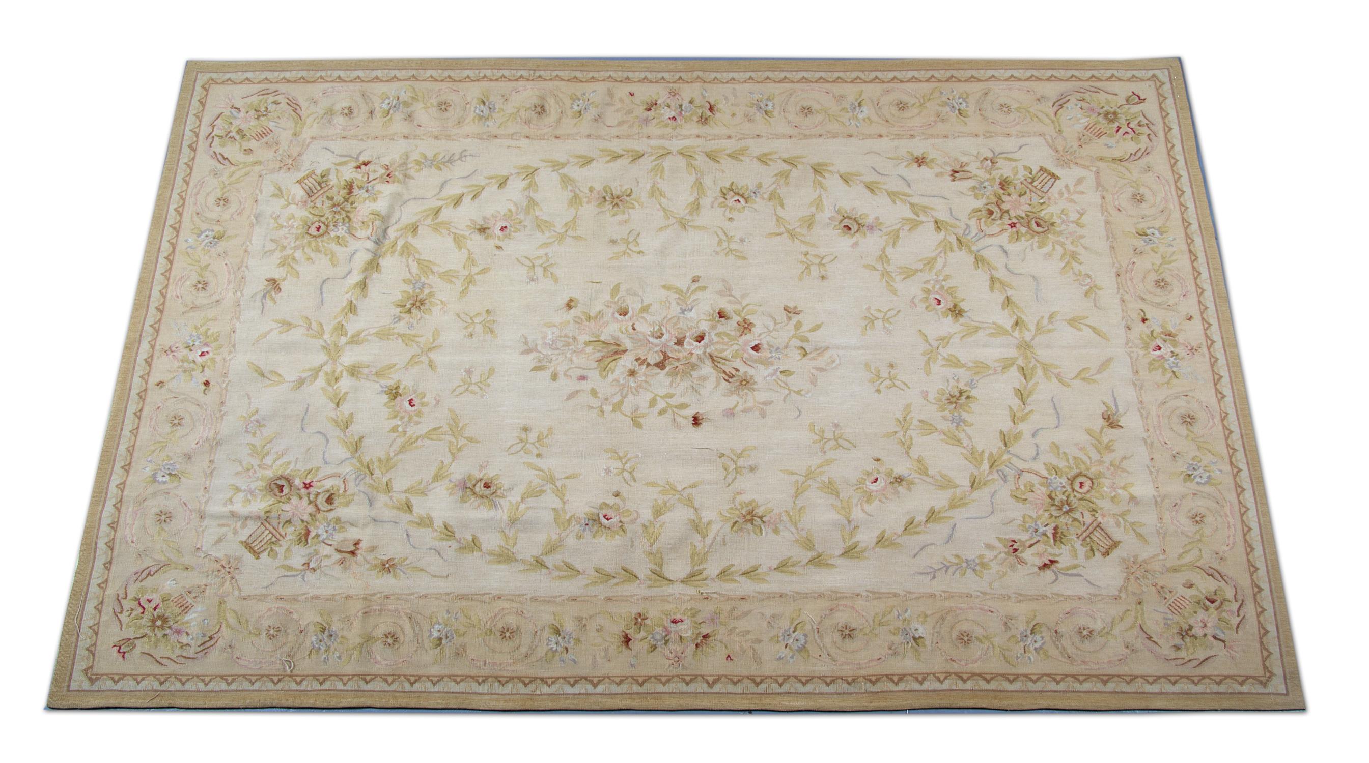 This beautifully handwoven Aubusson reveals a traditional floral design. Woven symmetrically in subtle creams, greens and beiges that come together to create a magnificent accent piece.
This style of rugs are best known as Aubusson, recognized