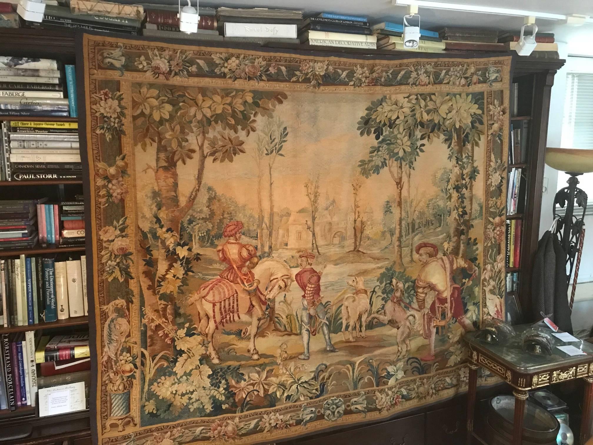 This tapestry is in outstanding condition both in structure and in the way which the colours are preserved. While quite large, ii can be accommodated in most homes. The hunting party in the foreground and romantic castle in the background provide a