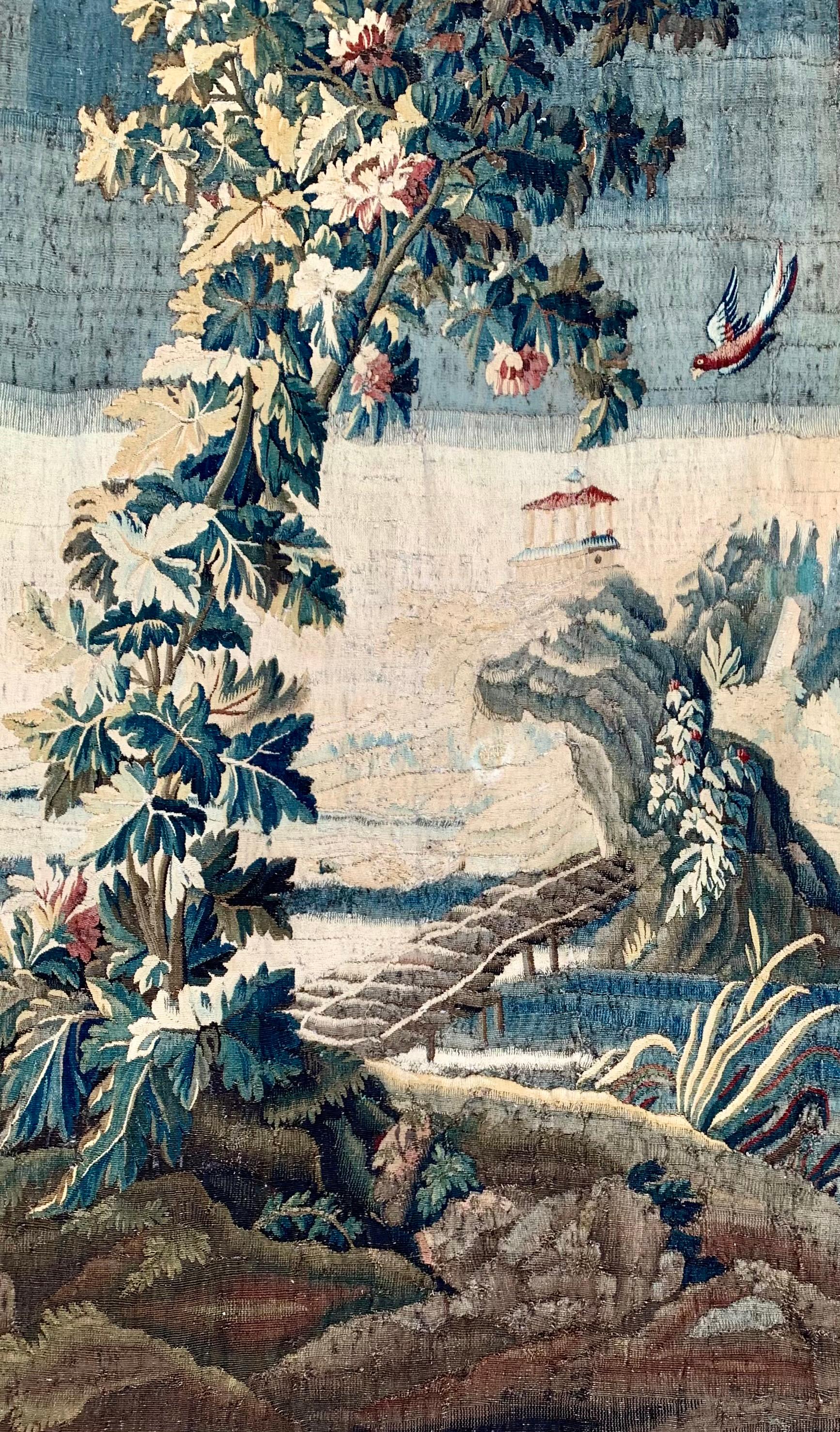 Wonderful original French Aubusson tapestry from ca. 1785 in good condition. The scenery is very well composed with a forrest, foliage and greens in the foreground, known as a  