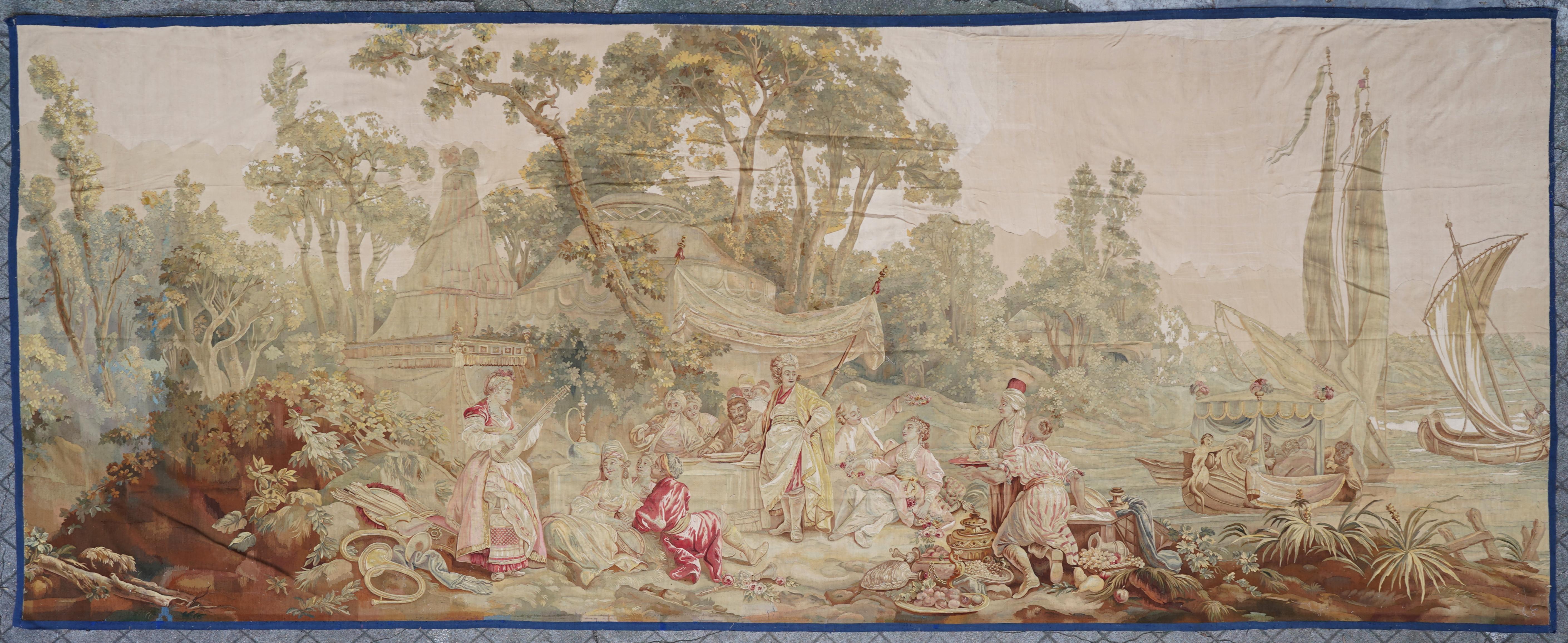 Beautiful wool and silk tapestry representing a banquet of a Pasha. While the guests eat, servants bring the dishes and musicians entertain the assembly.

Tapestries were used to richly decorate a house and keep the heat inside a room by
