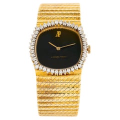 Reloj Audemars Piaget de oro amarillo de 18 quilates con esfera negra y halo de diamantes, 6,25 pulgadas Reloj Audemars Piaget de oro amarillo de 18 quilates con esfera negra y halo de diamantes, 6,25 pulgadas