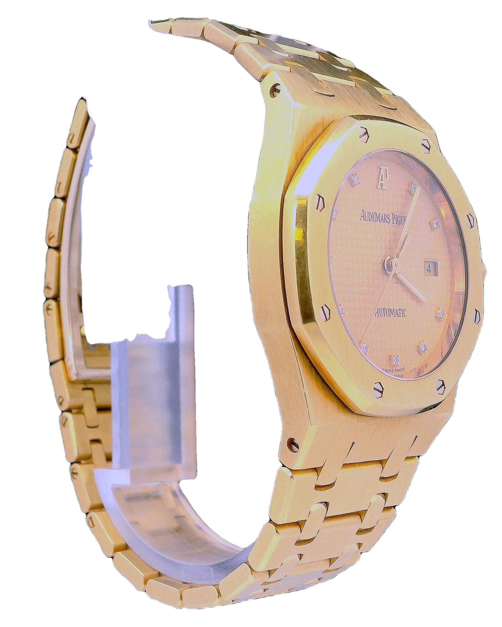 Audemars Piguet 15000BA Royal Oak Watch. 33mm 18K yellow gold case. 18K yellow gold octagon shaped bezel. Champagne tapestry dial with luminous gold hands and factory diamond hour marker. Date display at 3 o'clock position. 18K yellow gold bracelet