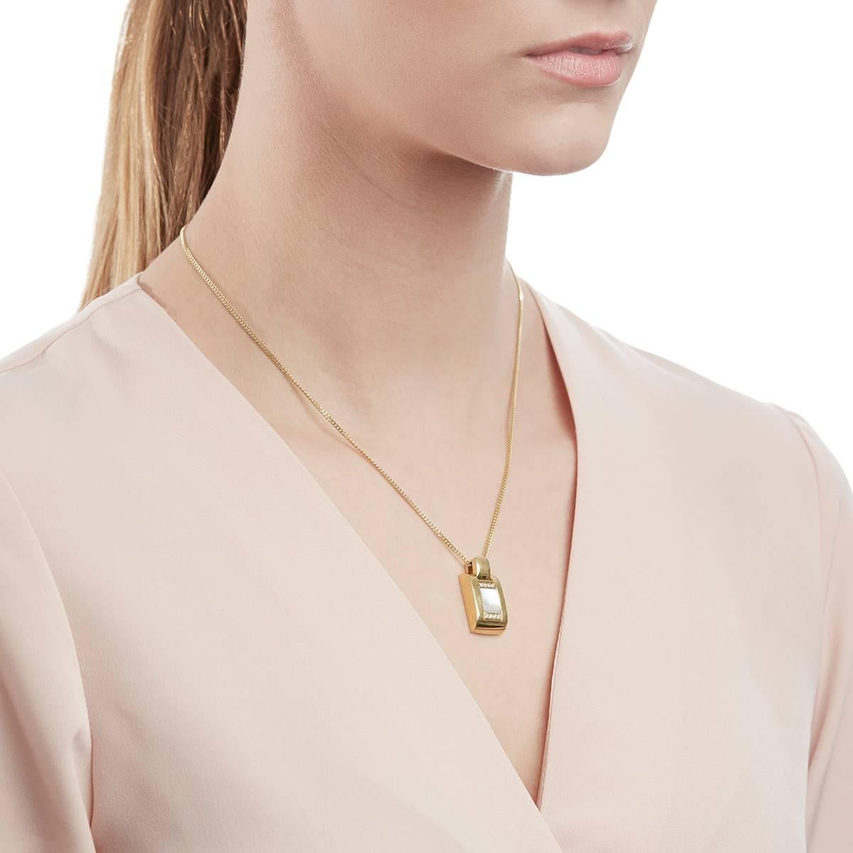 This Necklace by Audemars Piguet features a Pendant with Mabe Pearl and 8 round brilliant cut Diamonds of 0.08ct total colour G, clarity VS, made in 18k Yellow Gold with a total weight of 16.97 grams. The chain length is 46cm with a pendant width of