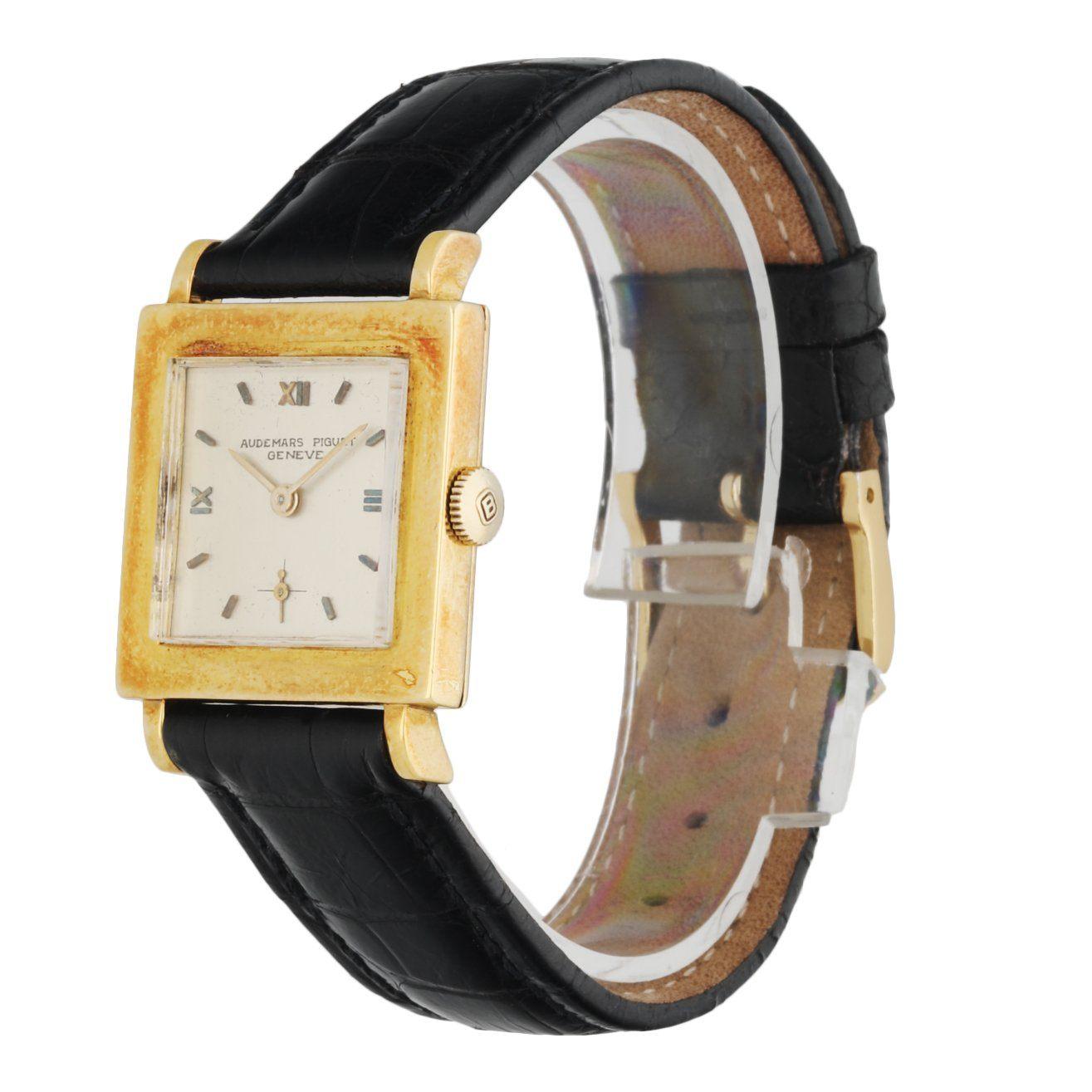 Audemars Piguet vintage ladies watch. 25MM 18K yellow gold case. Silver dial with gold hands and index & Roman numeral hour marker. Black leather strap with golden tone buckle. Will fit up to 7.5-Inch wrist. Sapphire crystal and 18K yellow gold case