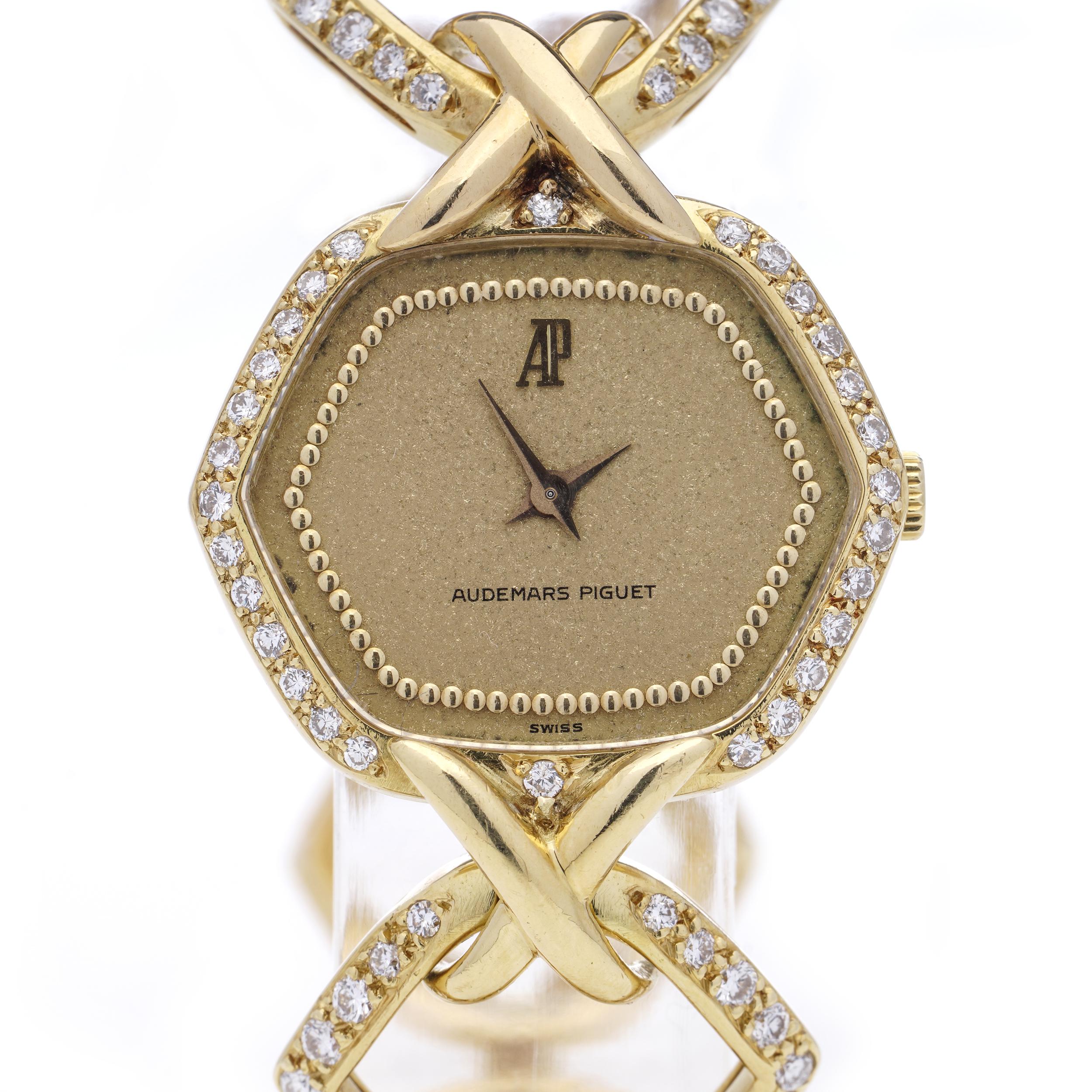 Audemars Piguet Vintage dress watch ultra-thin 18kt yellow gold with link bracelet.
Bezel and bracelet is set with brilliant diamonds. 

Dial Colour: Gold 
Country/Region of Manufacture: Switzerland
Department: Women 
Movement: Manual hand winding