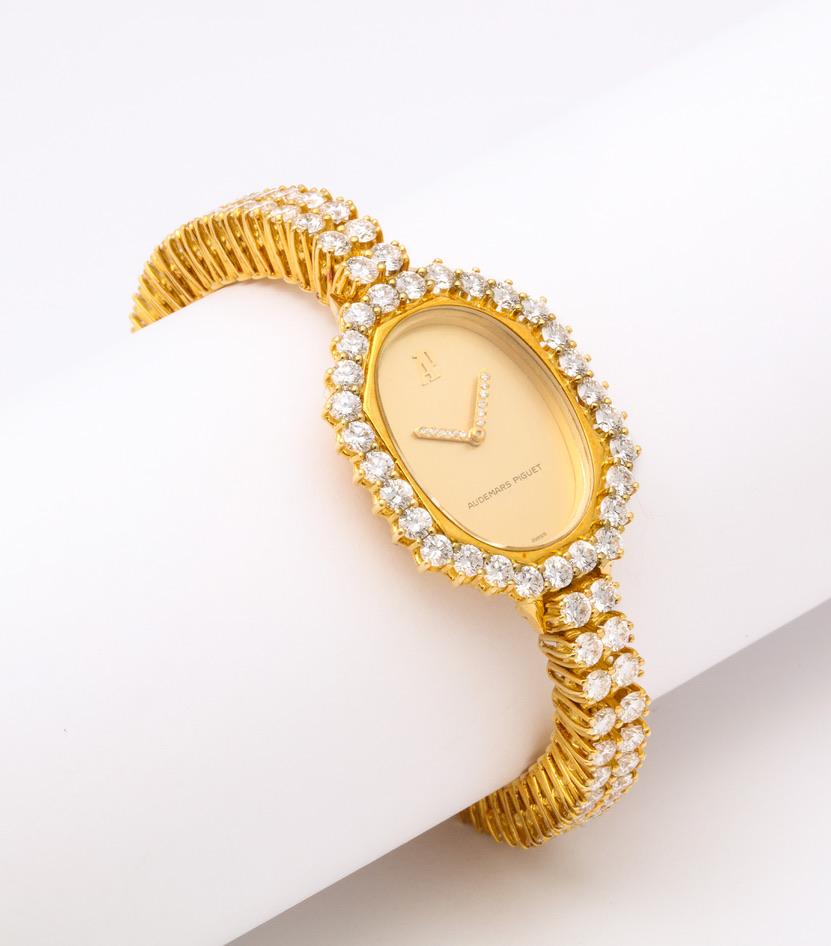 Pure 1970s chic, this diamond watch is as stylish today as it was upon it's launch.  The highest quality white diamonds are meticulously set in two rows as well as around the case.  The hands are even set with single cut diamonds.

Just over 6 1/2