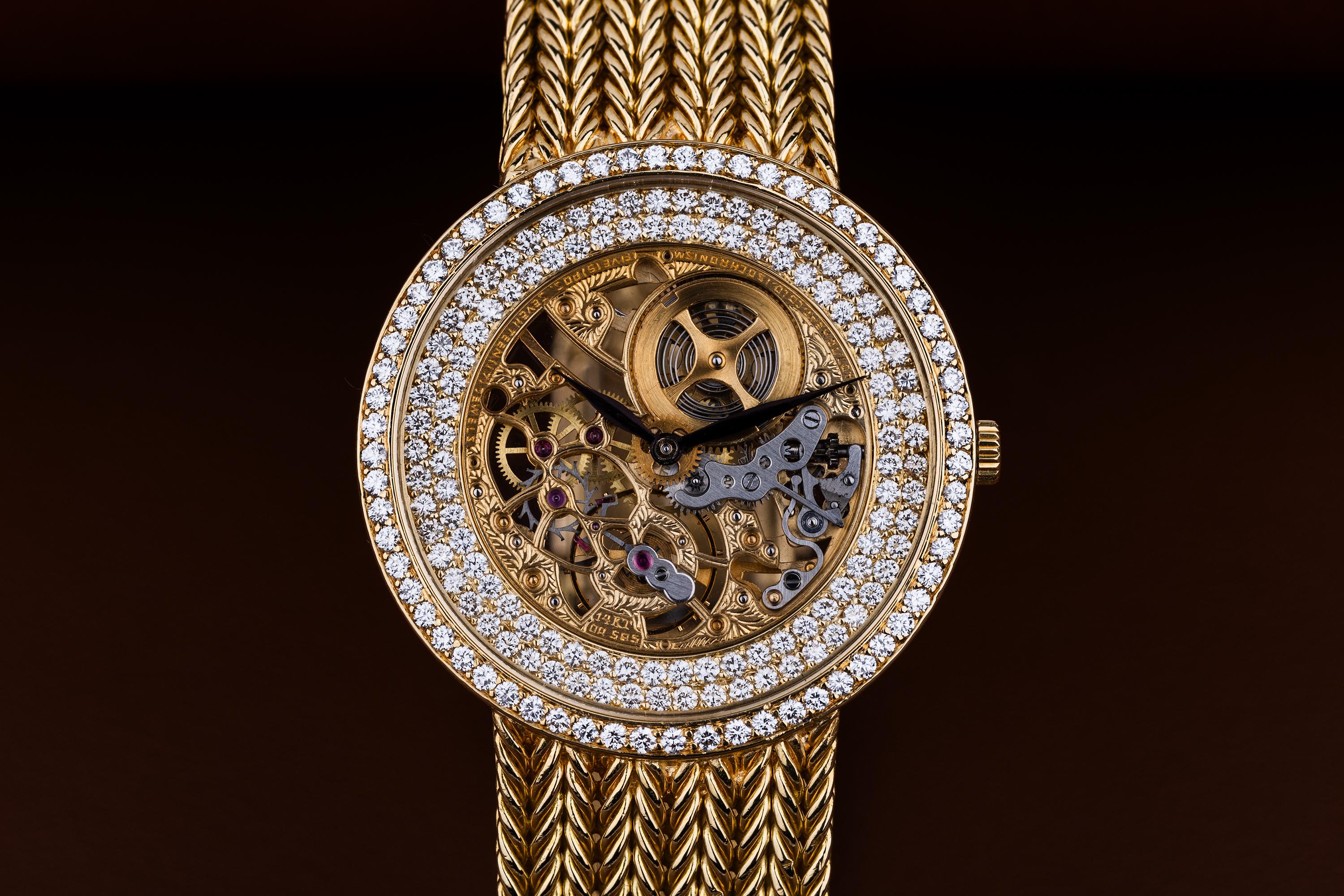 Pre-owned, excellent condition Audemars Piguet 18k Yellow Gold open-worked skeleton diamond unisex wristwatch. Skeleton, open-worked dial surrounded by a double row of diamonds on the outer dial, an 18k Yellow Gold 32mm case, diamond bezel, winder,