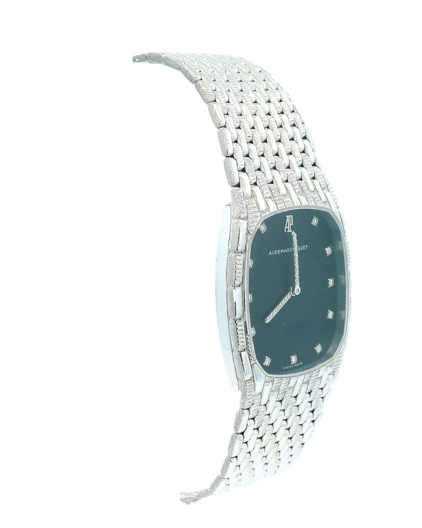 The Audemars Piguet 4126 Ladies Watch is a luxurious timepiece designed for elegance and sophistication. The watch features a 27mm case made of 18K white gold, complemented by an 18K white gold bezel. Its striking black dial is adorned with
