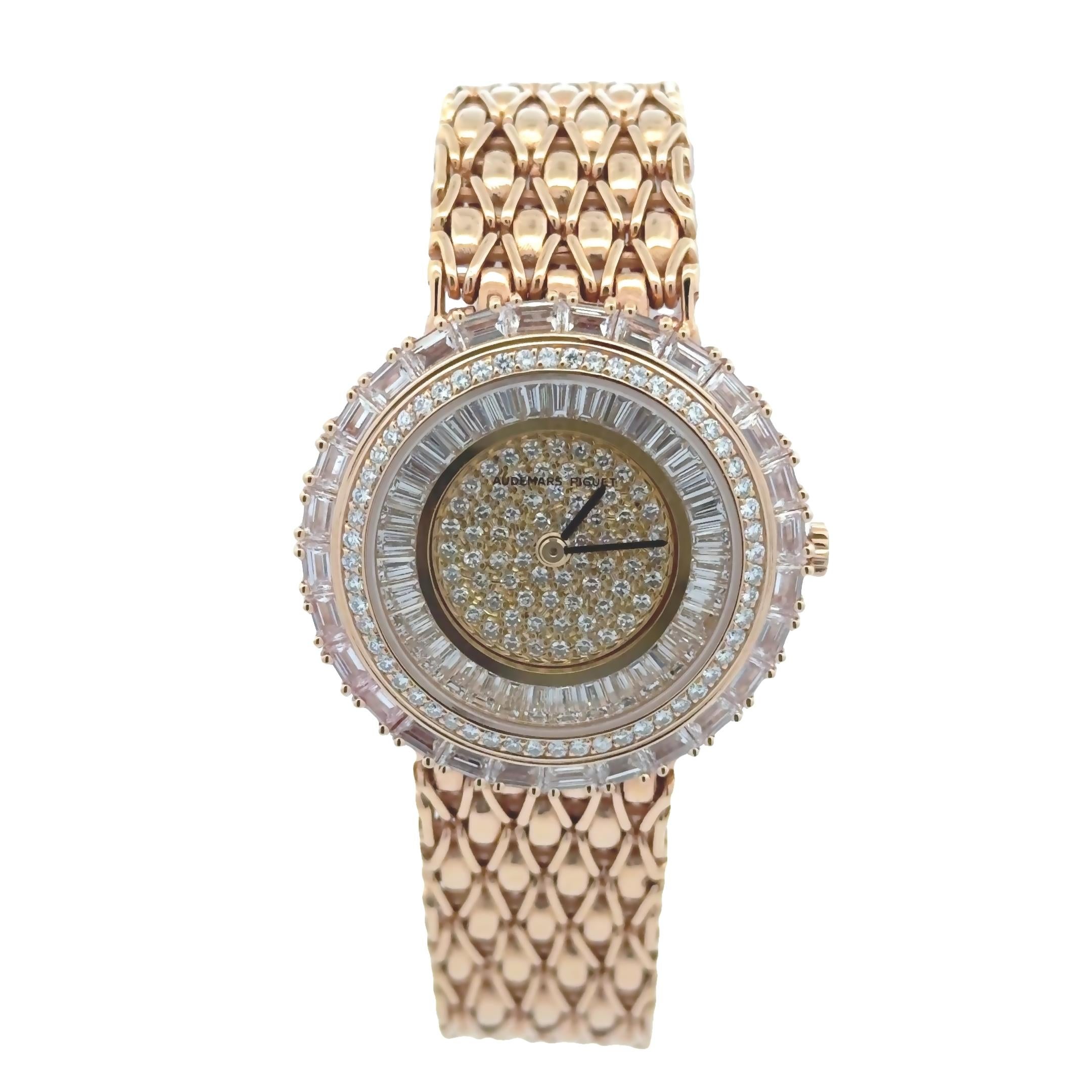 A stunning ladies' watch created by Audemars Piguet from the Special Edition Classique, featuring a diamond encrusted round shape dial accented by a triple halo of baguette and round cut diamonds with an 18K yellow gold bracelet made with intricate