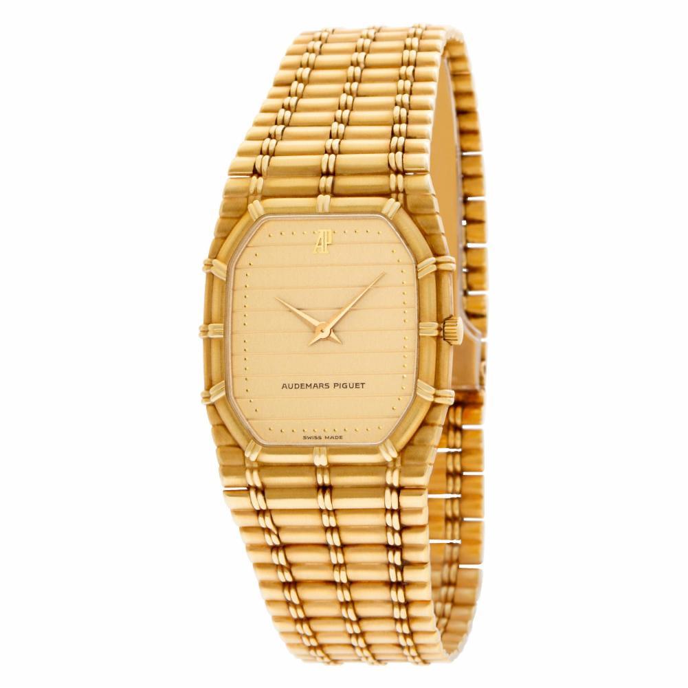 Audemars Piguet Bamboo in 18k. Quartz. 27 mm case size. Fits 7 inches wrist. With box. Ref 56205. Circa 1990s. Fine Pre-owned Audemars Piguet Watch. Certified preowned Classic Audemars Piguet Bamboo 56205 watch is made out of yellow gold on a 18k