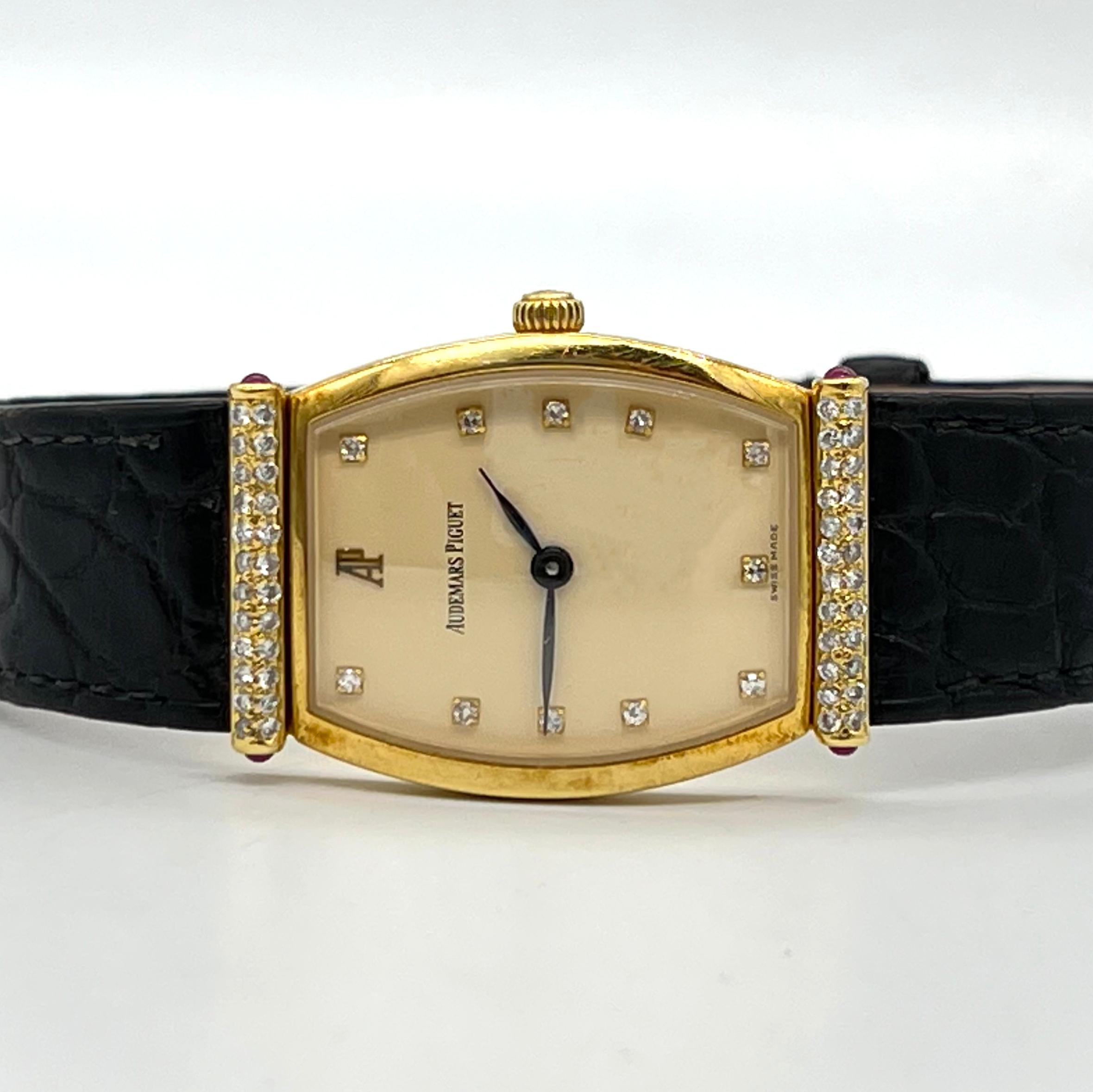 Authenticity Guarantee, Audemars Piguet Carnegie classic ladies watch in 18K yellow gold, 16cm diamond bezel. Reference number: 14941. This watch has a folding butterfly clasp. Quartz Operated movement with a brand new battery installed. A classic