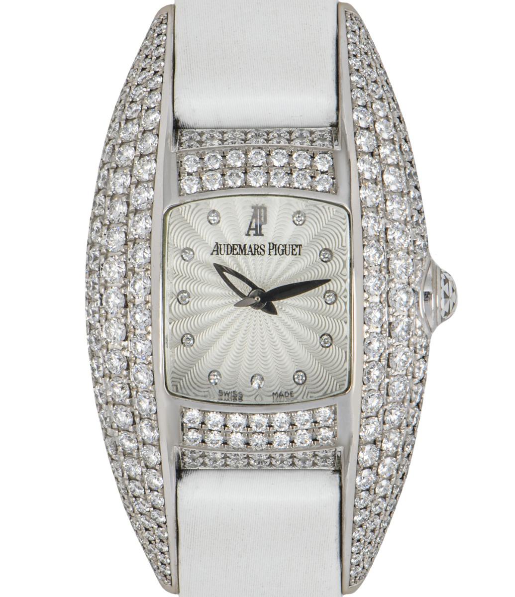 This Audemars Piguet Dream Women's Wristwatch really is a Dream!

Crafted from 18k white gold, it features a silver guilloche dial set with 11 diamond hour markers, a fixed bezel and case set with approximately 260 diamonds. Set to the side of the