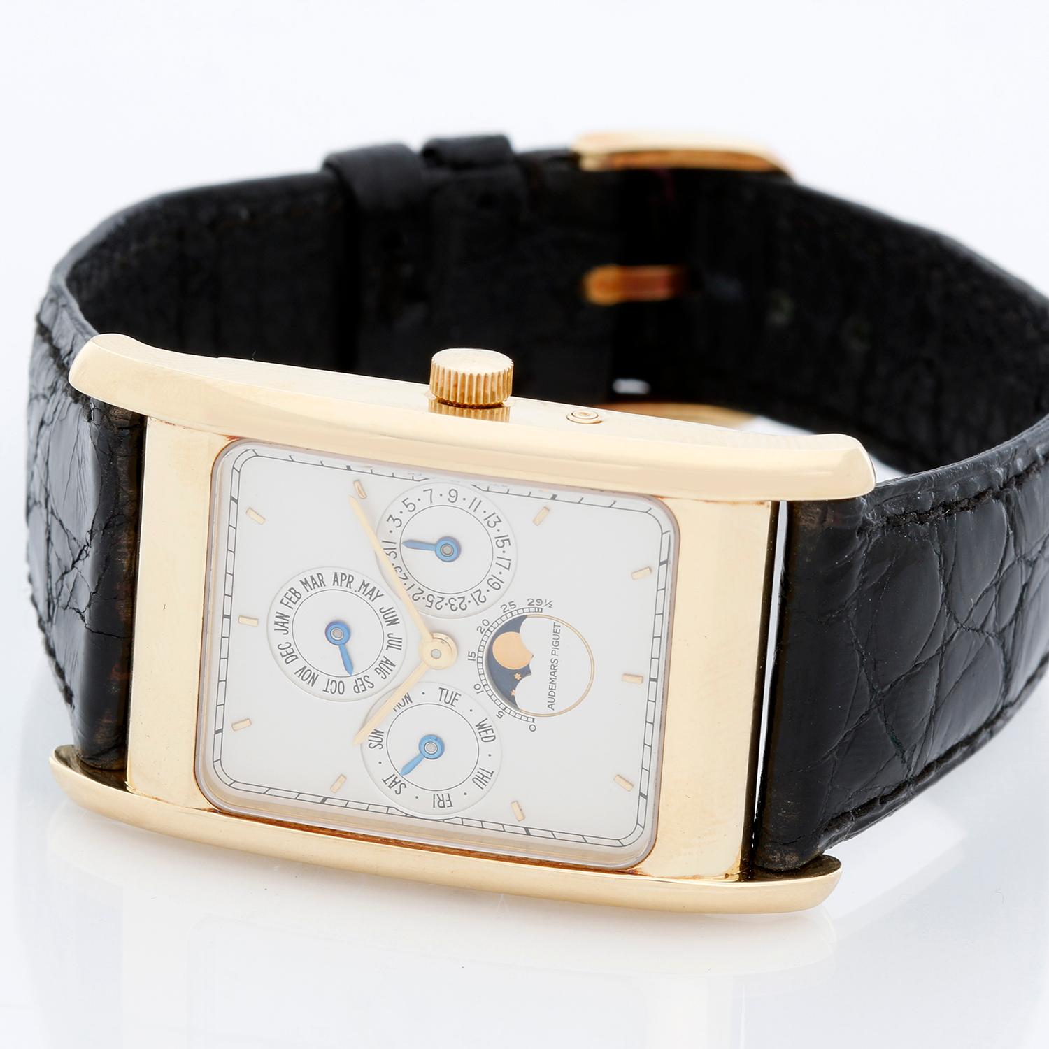 Audemars Piguet Edward Piguet Perpetual Calendar Men's 18k Yellow Gold Watch - Manual winding. 18K yellow gold ( 35 x 27 mm ). Silver Gray dial with stick hour markers; Date, Day, Month, Moon Phase, Perpetual Calendar. Black alligator strap.
