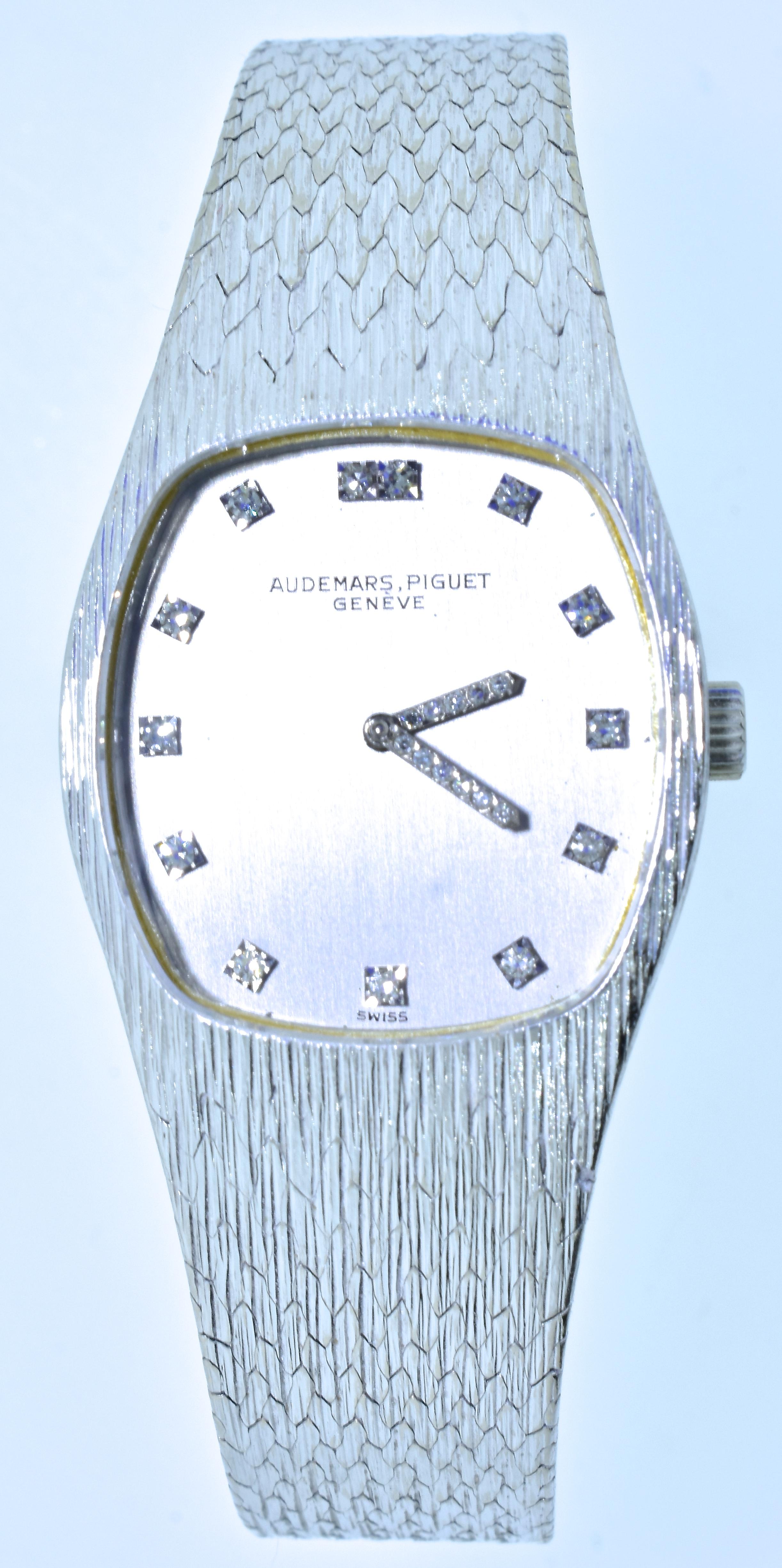 Audemars Piguet diamond and 18K white gold wristwatch, mechanical (manual wind), high jeweled movement with crystal dial, textured original band and diamond markers and diamond hands - all original.  In excellent condition, signed on the movement,