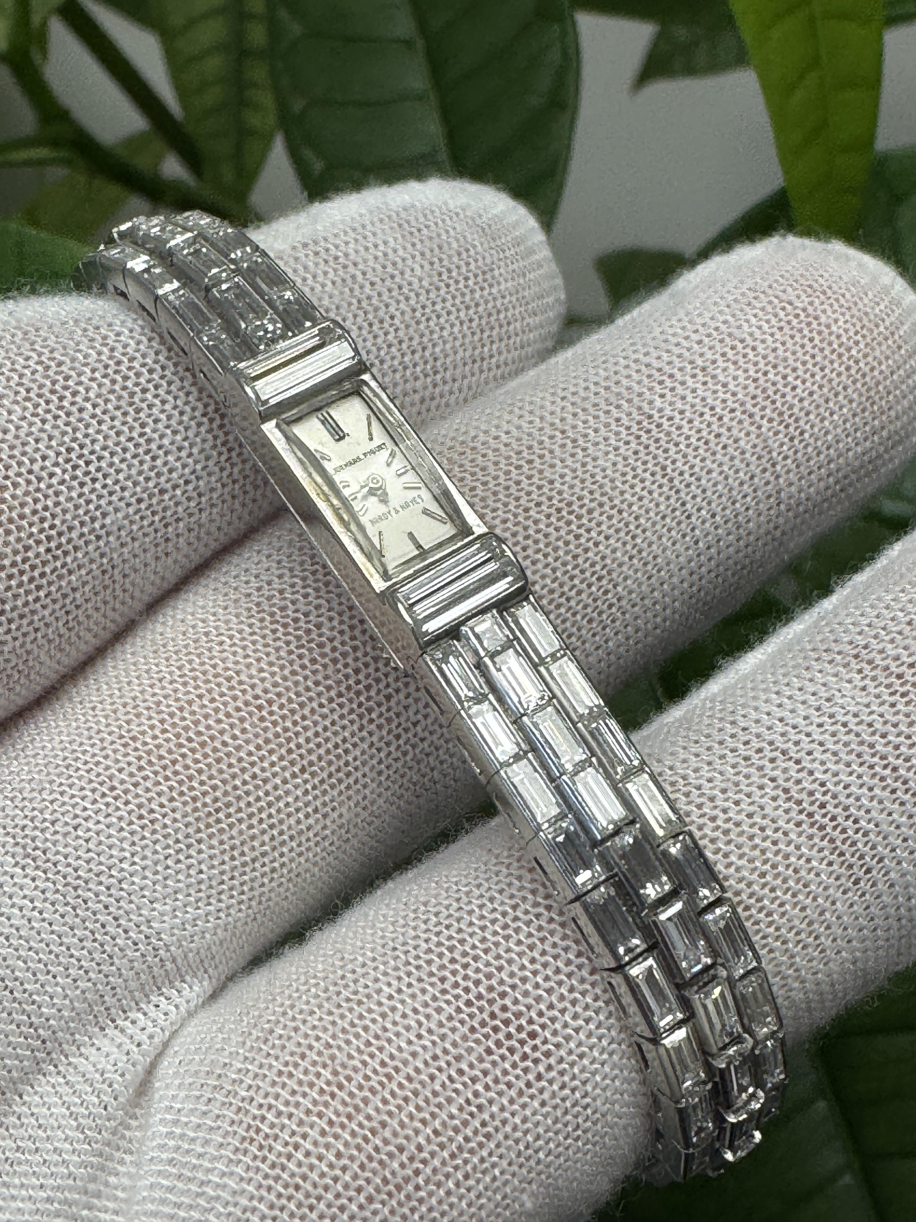 This exquisite timepiece, crafted by Audemars Piguet in Switzerland in 1950, features a manual movement and a rectangular face with dimensions of 8 mm by 21.2 mm. The sleek silver dial is adorned with stick indexes and is housed in a platinum case