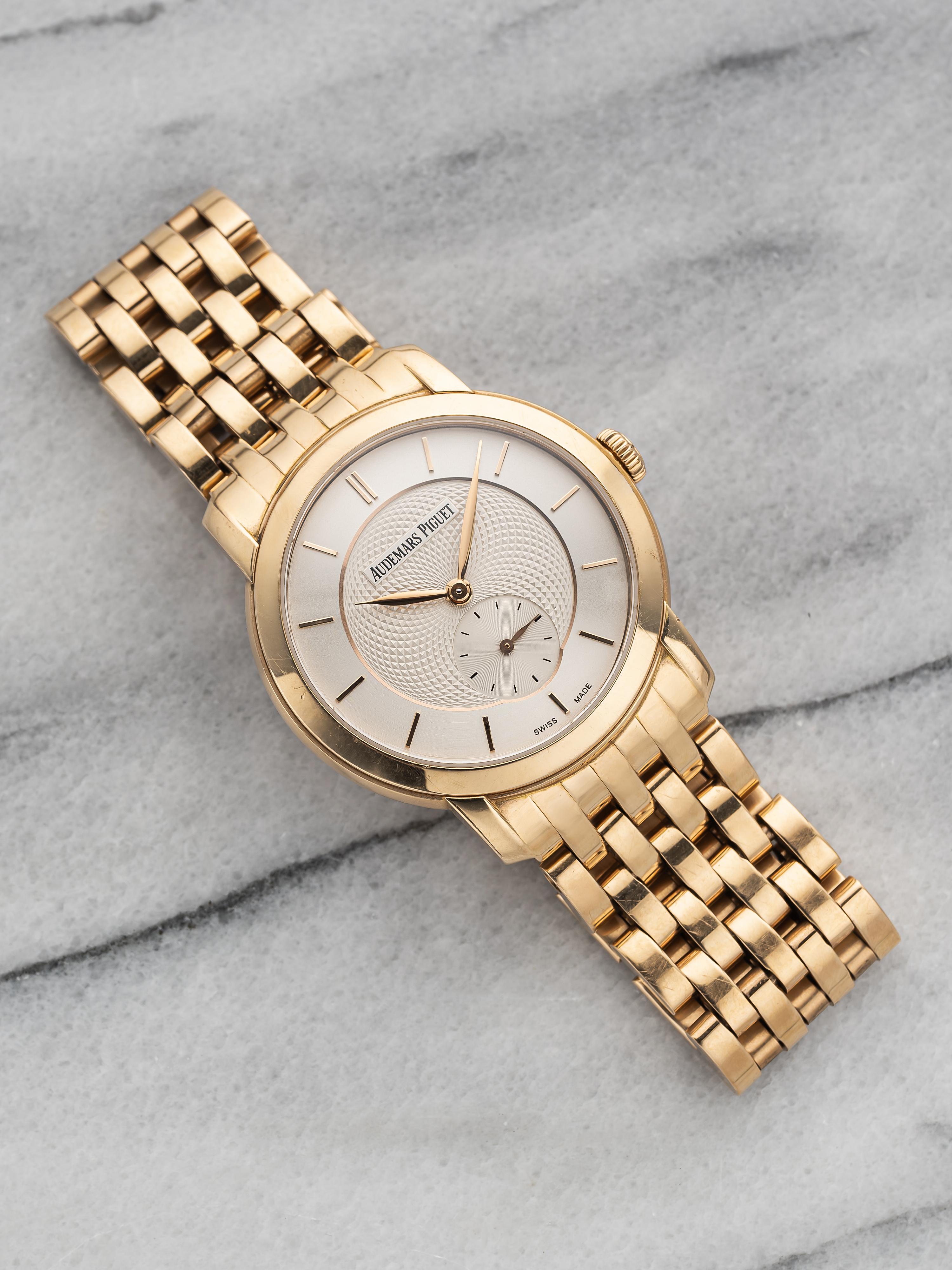 Here we have a Audemars Piguet automatic in18k rose gold with a beautiful white guilloche dial from 2014. Comes with its original papers. Keeps great time and is fully functional. Measurements of the case is 35mm including the crown. Quickset date