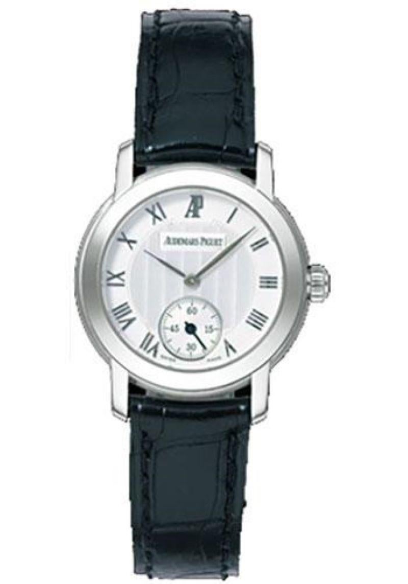 27mm white gold case, white gold bezel, silver dial with leaf hands and roman markers, and small seconds at 6 o'clock, manual winding movement with hours, minute, seconds, black crocodile leather strap. Water resistant to 20 meters.