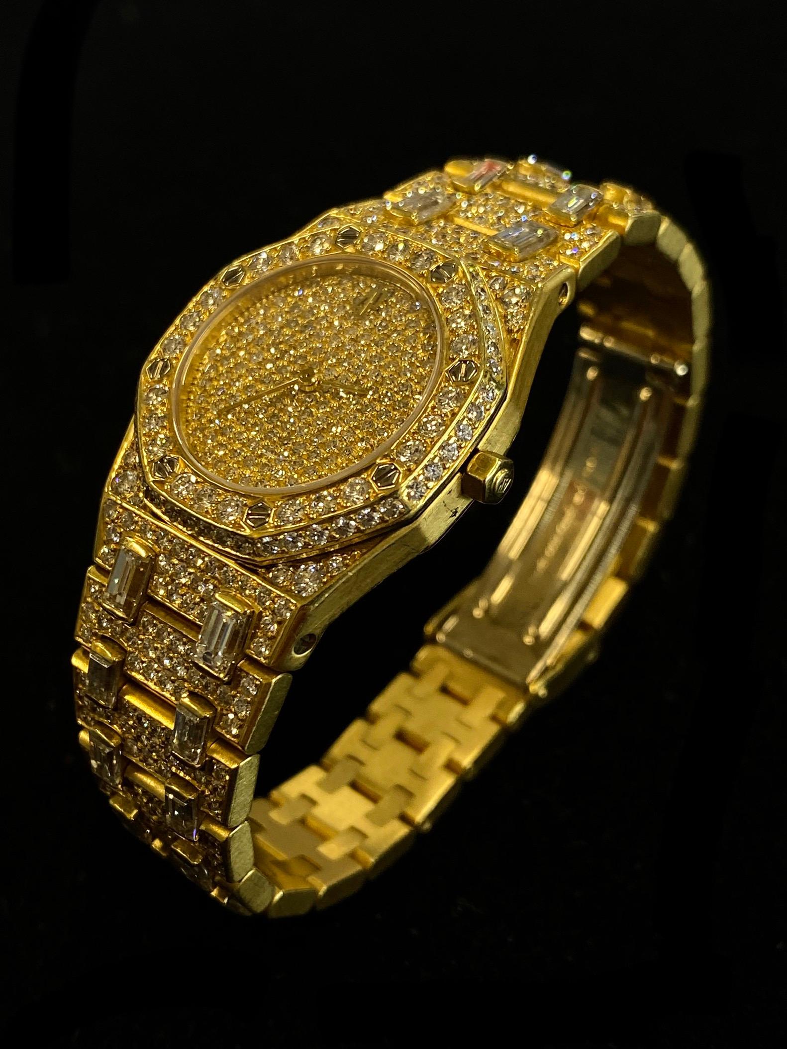 AUDEMARS PIGUET LIMITED EDITION ROYAL OAK 18K YELLOW GOLD LADIES WRISTWATCH W/ APPROX. 664 FACTORY DIAMONDS

ITEM DESCRIPTION: 
With Swiss construction and Audemars-Piguet distinction, this Royal Oak 18K Yellow Gold wristwatch keeps time as