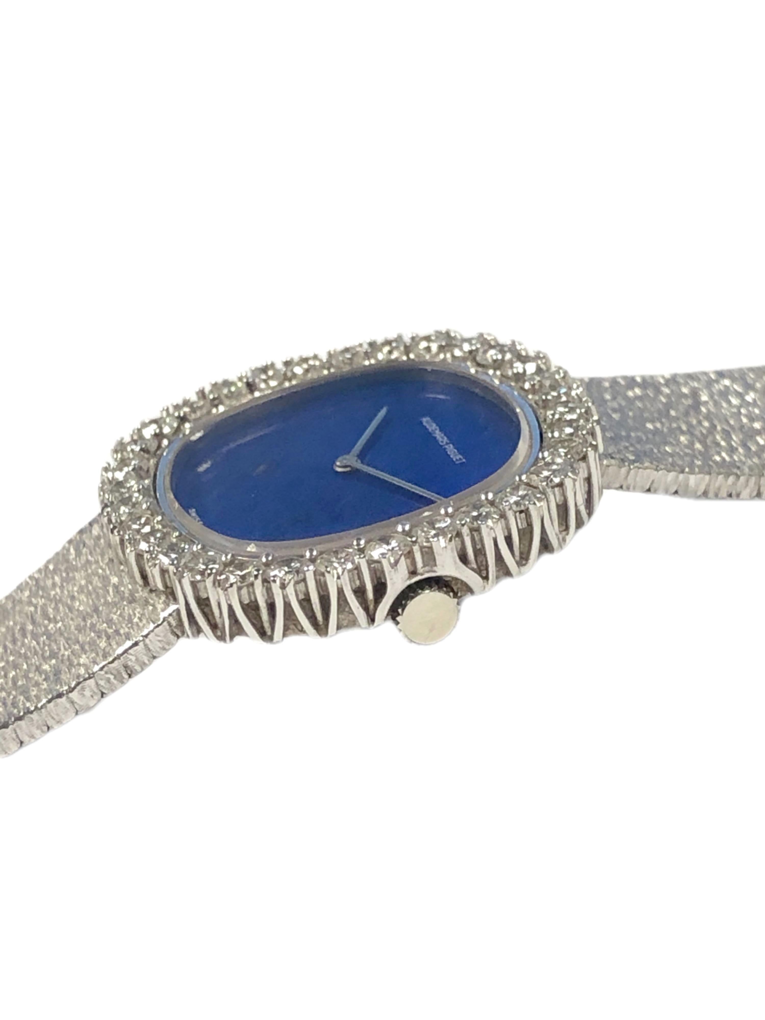 Circa 1980 Audemars Piguet Ladies Wrist Watch, 28 X 27 M.M. 18K White Gold 2 piece case with a Diamond set bezel, the stones are very fine White Round Brilliant cuts totaling 2.30 Carats. Lapis Lazulli Dial and White gold hands. 17 Jewel,