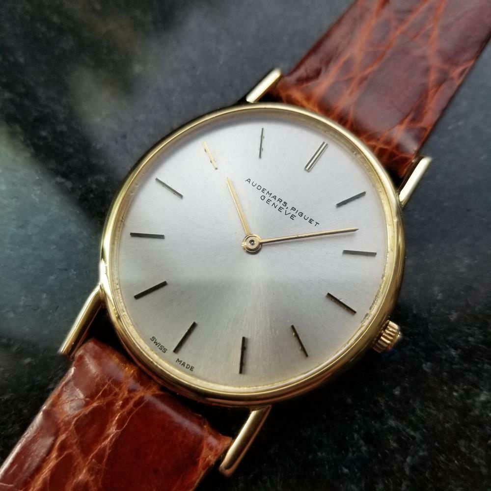 Luxurious elegance, men's 18k solid gold Audemars Piguet Geneve cal.2120 automatic dress watch, c.1980s. Verified authentic by a master watchmaker. Gorgeous silver Audemars Piguet signed dial, applied indice hour markers, gilt minute and hour hands,