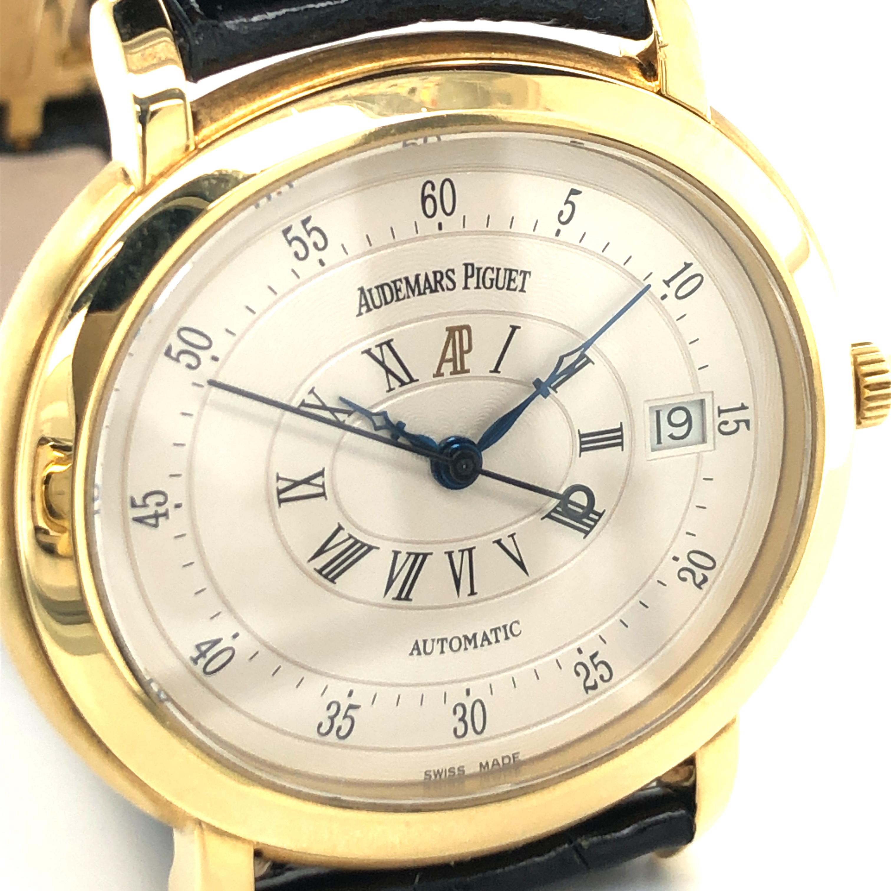 Preowned Gents Audemars Piguet Millenary in 18karat yellow gold Ref. 14908. Comes with new black AP leather strap and original AP yellow gold deploying clasp. The oval case measures 39 x 35 mm. Scratch resistant sapphire crystal.

Beige Roman and