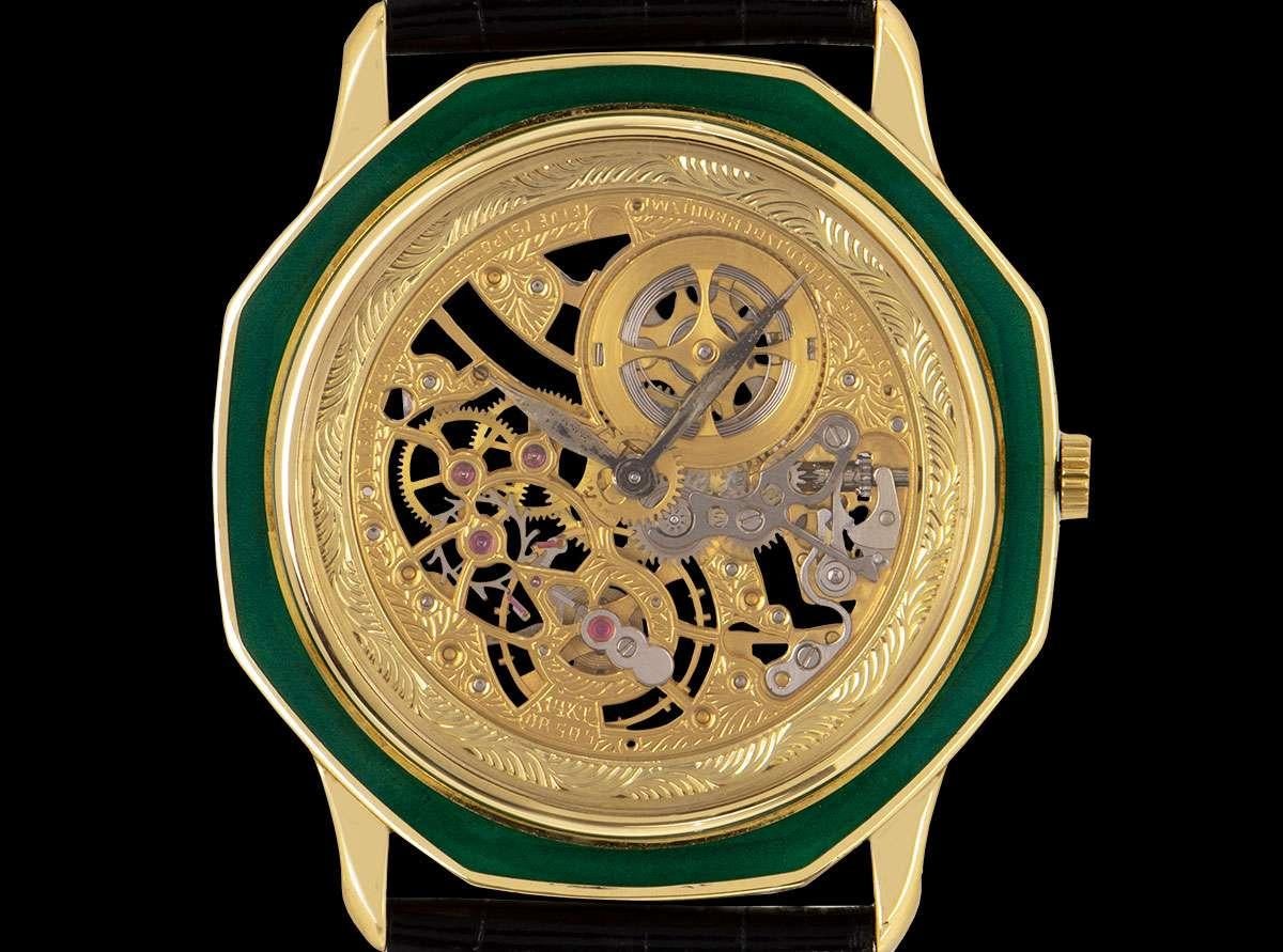A Rare 18k Yellow Gold 31mm Octagonal Skeleton Gents Wristwatch, skeleton dial, a fixed 18k yellow gold bezel set with green enamel, an original black leather strap with an original 18k yellow gold pin buckle, mineral glass, exhibition caseback,