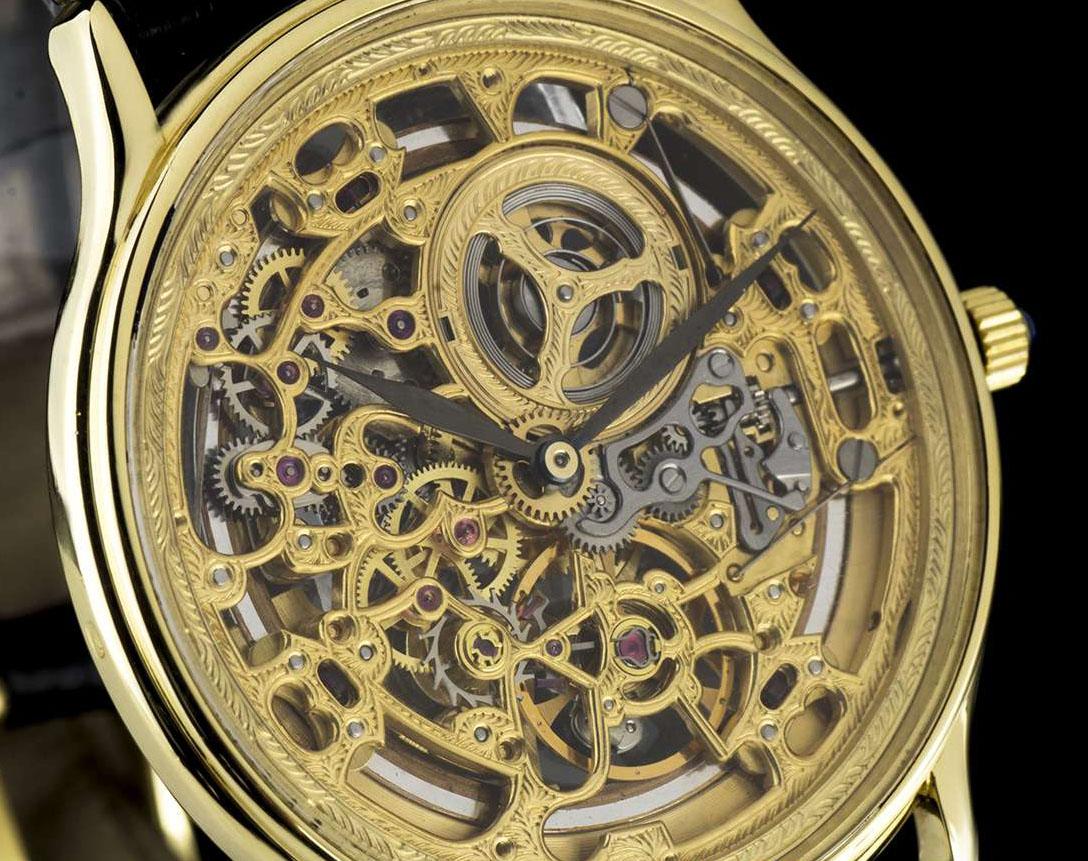 An 18k Yellow Gold Gents Wriswatch, skeleton dial, a polished 18k yellow gold fixed stepped bezel, a brand new black leather strap (not by Audemars Piguet) with an original polished 18k yellow gold pin buckle, sapphire glass, automatic movement, in