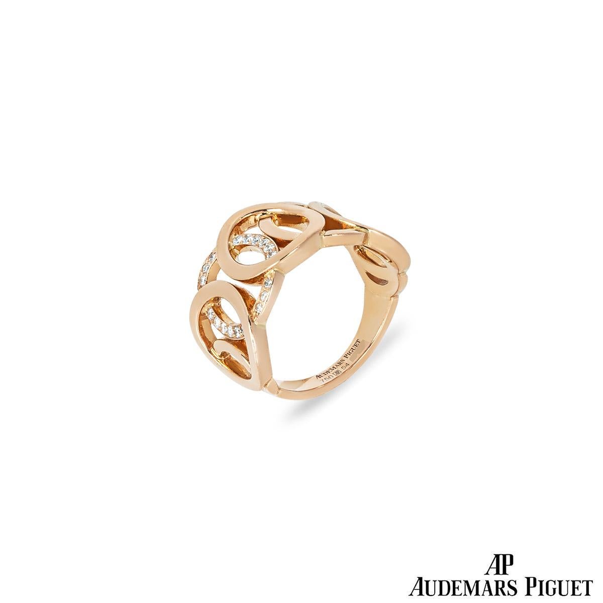 A charming 18k rose gold diamond set ring by Audemars Piguet, from their Millenary collection. The dress ring features 5 large interlocking circles and 2 small ones. One of the circles is pave set with 18 round brilliant cut diamonds which have an