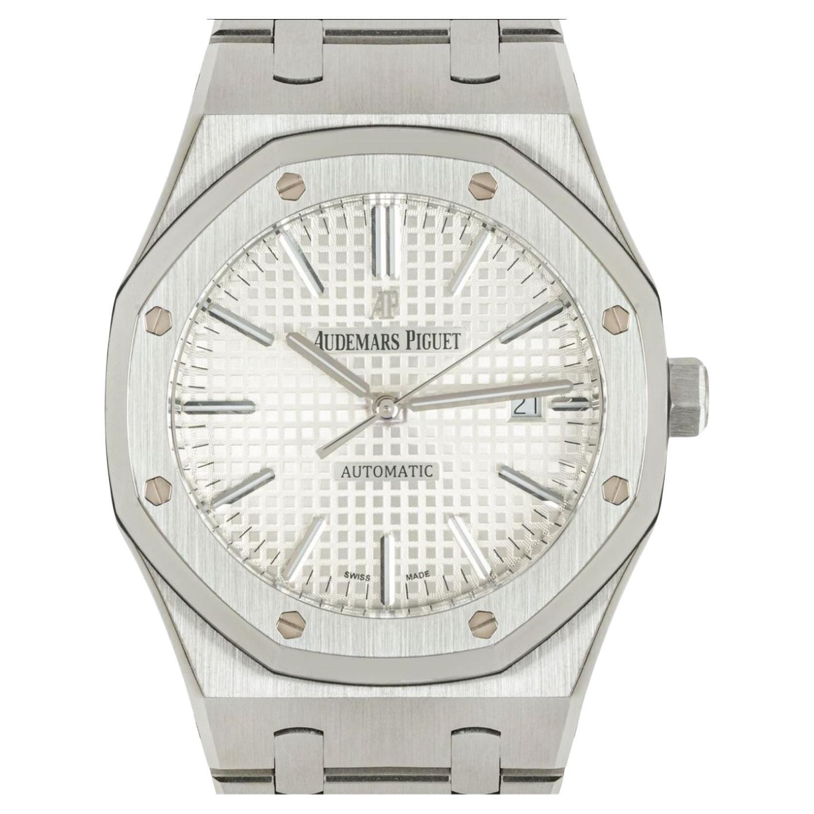 A 41mm stainless steel Royal Oak by Audemars Piguet. Features a white guilloche dial with grande tapisserie pattern, a date aperture and a stainless steel bezel featuring the iconic 8-screw design.

Equipped with a steel bracelet and an AP folding