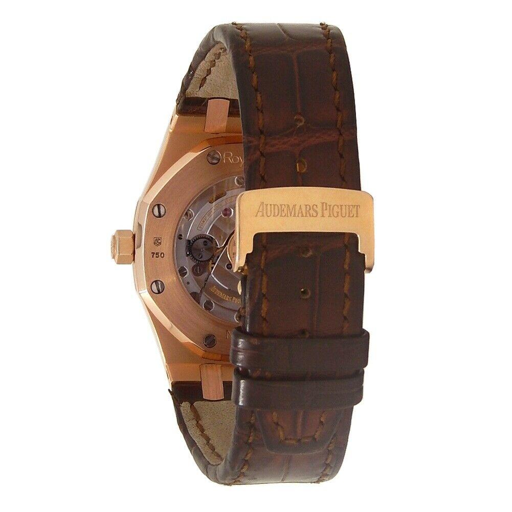 Brand: Audemars Piguet
Band Color: Brown	
Gender: Men's
Case Size: 36-39.5mm	
MPN: Does Not Apply
Lug Width: 26mm	
Features:	12-Hour Dial, Date Indicator, Gold Bezel, Sapphire Crystal, Swiss Made, Swiss Movement
Style: Casual	
Movement: Mechanical