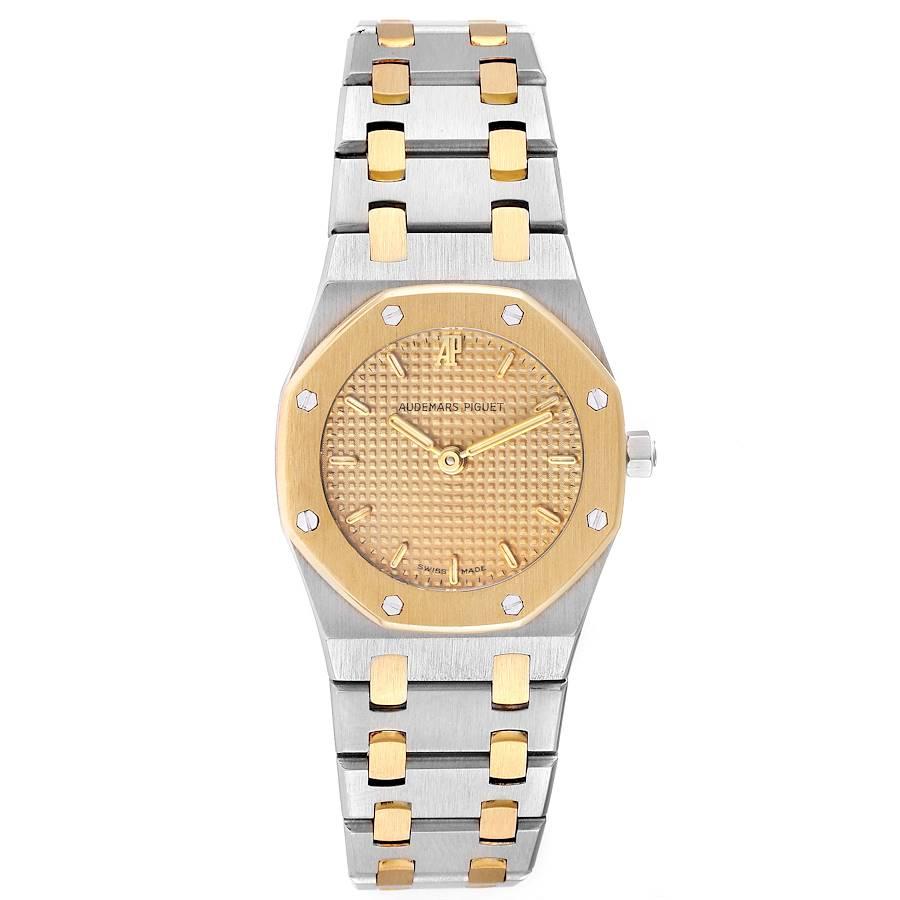 Audemars Piguet Royal Oak 24mm Steel Yellow Gold Ladies Watch. Quartz movement. Brushed stainless steel and 18K yellow gold case 24.0 mm in diameter. 18K yellow gold bezel punctuated with 8 signature screws. Scratch resistant sapphire crystal.