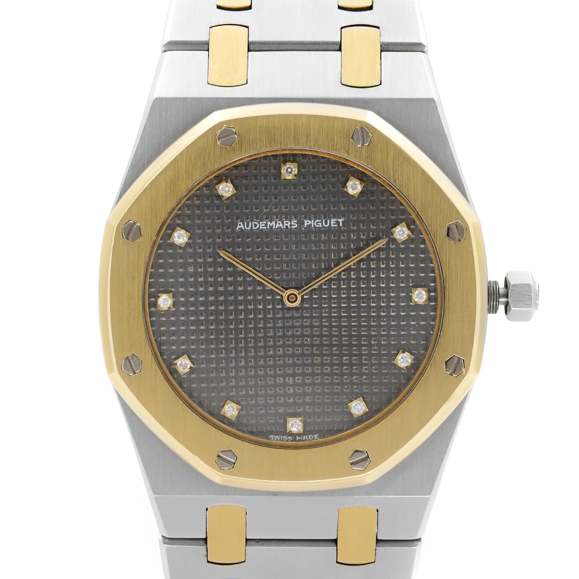 Pre-Owned Audemars Piguet Royal Oak 33mm 18K Gold Steel Diamond Gray Dial Quartz Men Watch. factory Diamond Dial. The Watch is empowered by a Quartz Movement. This Beautiful Timepiece Features: Brushed Octagon Stainless Steel and Yellow Gold Case