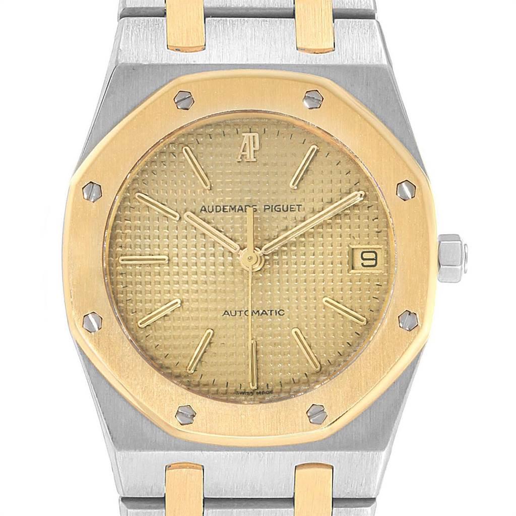 Audemars Piguet Royal Oak 33mm Grey Dial Steel Yellow Gold Mens Watch. Automatic self-winding movement. Brushed stainless steel and 18K yellow gold case 36.0 mm in diameter. 18K yellow gold bezel punctuated with 8 signature screws. Scratch resistant