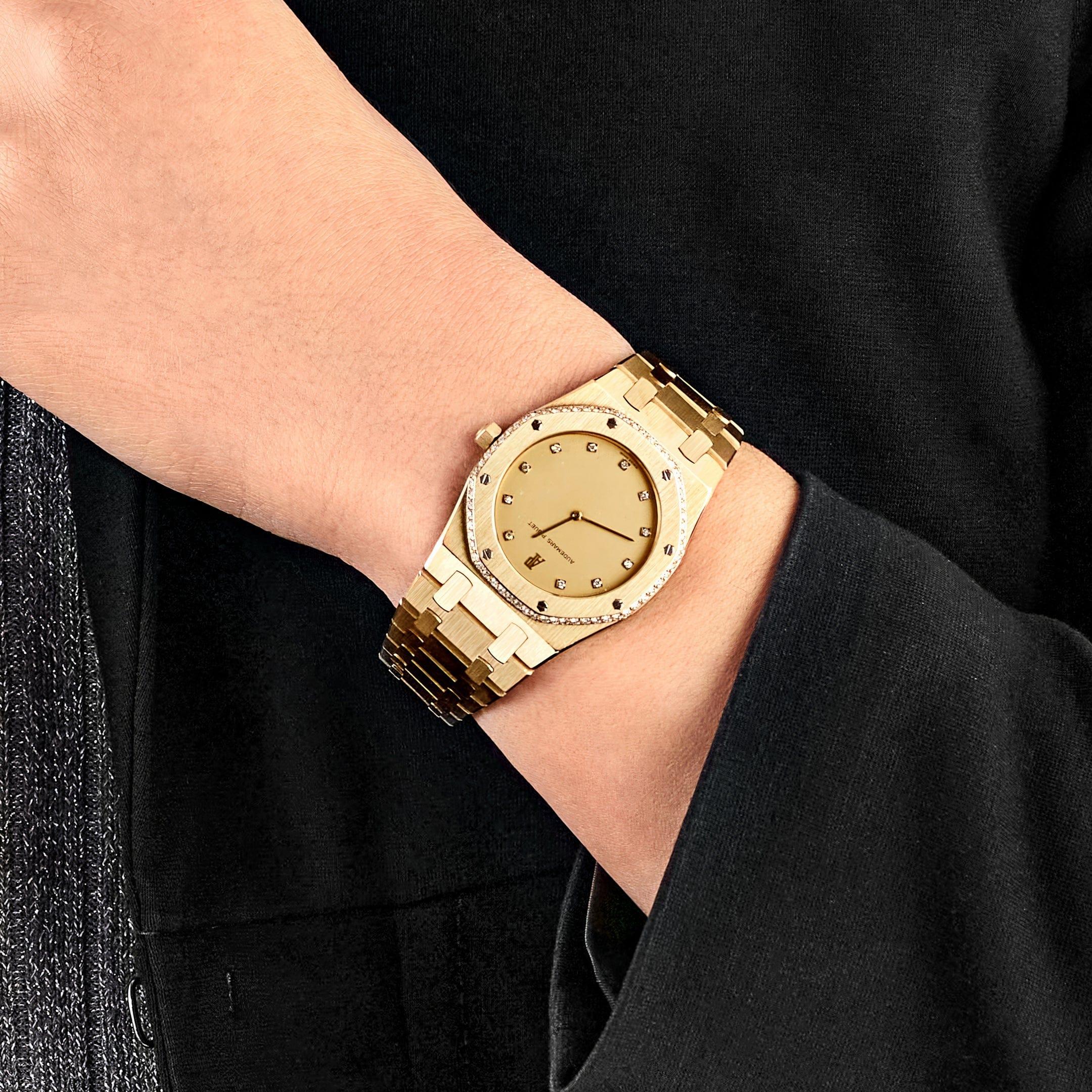 Jewels Aficionado offers the Audemars Piguet Royal Oak 4100BA is an exceptional timepiece that combines the bold design of the iconic Royal Oak with the elegance of yellow gold and diamonds. The 36mm case is crafted in 18k yellow gold, featuring the