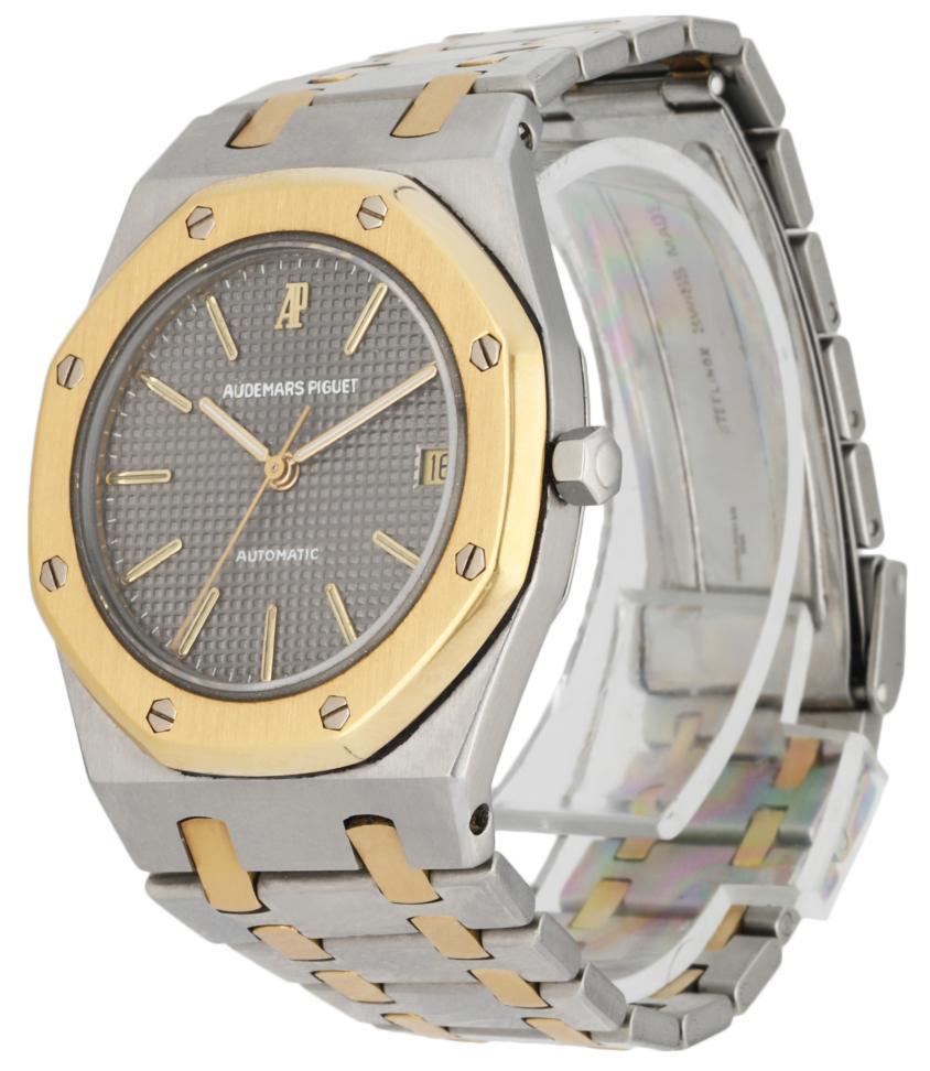 Audemars Piguet 4100SA Royal Oak men's watch. 36MM stainless steel case with 18K yellow gold octagon bezel. Grey tapestry pattern dial with gold hands and gold index hour marker. Date display at 3 o'clock position. Stainless steel and 18K yellow