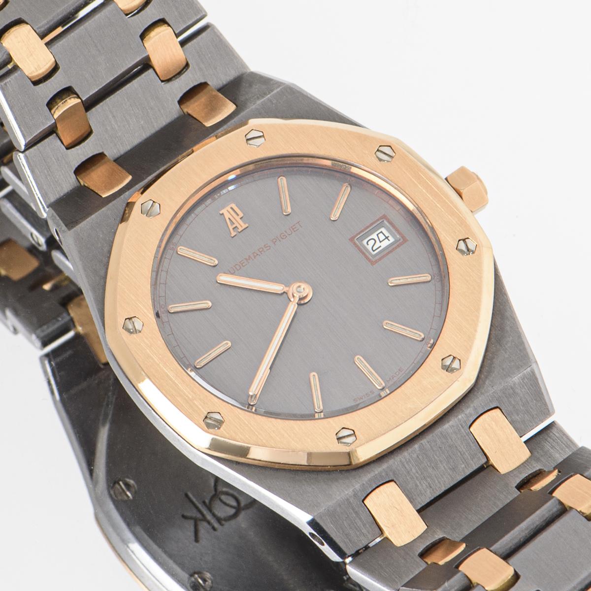 A 33mm mid-size Royal Oak in tantalum and rose gold from Audemars Piguet. Featuring an anthracite vertically brushed dial with the date at 3 o'clock. The rose gold bezel features the iconic eight screws which are synonymous with Audemars