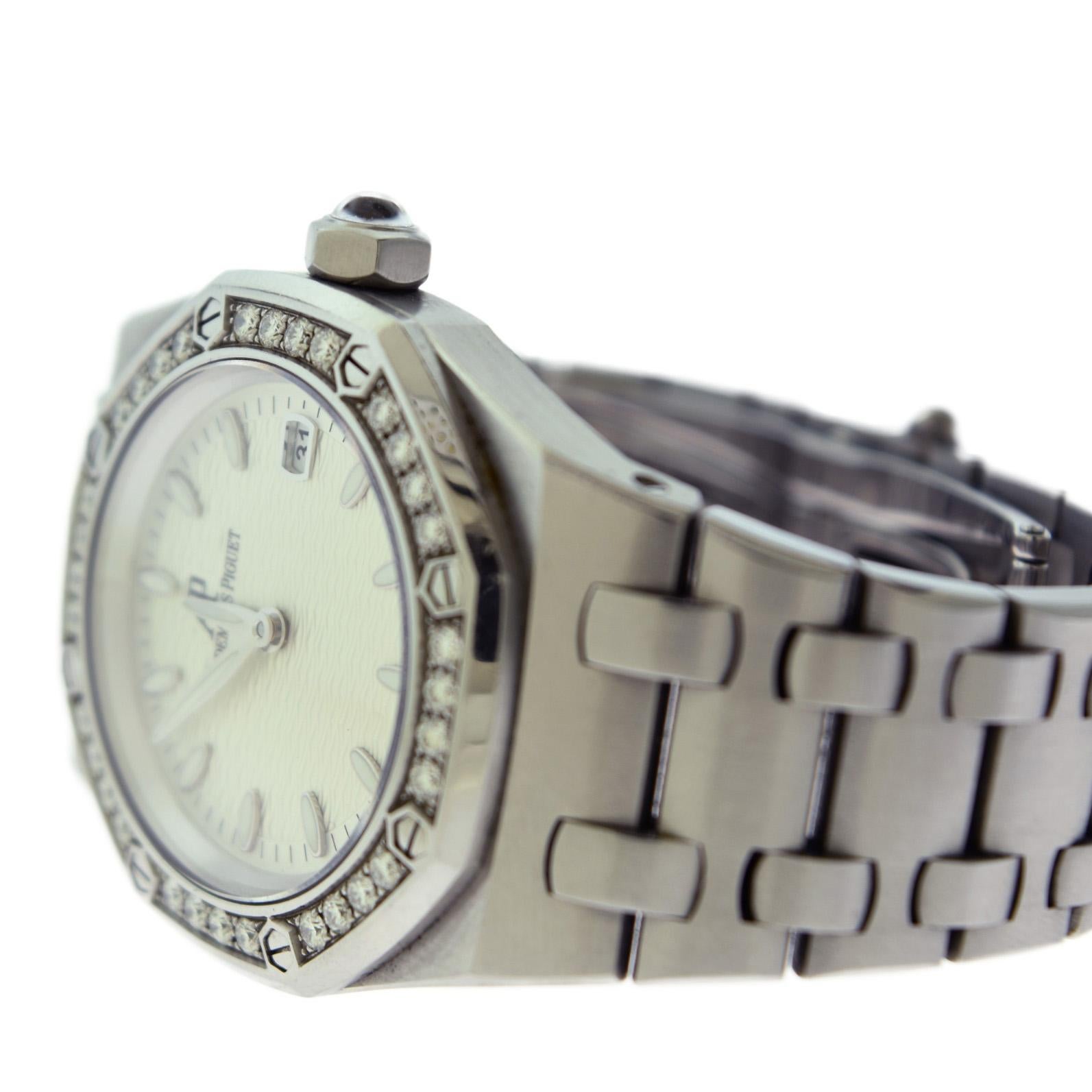Brand: Audemars Piguet 

Collection: Royal Oak 

Reference No.:  67601ST.ZZ.1210ST.01

Movement: Quartz

Case Material: Stainless Steel

Case Size: 33 mm

Case Shape: Octagonal

Bezel: Stainless Steel with Aftermarket Diamond Bezel

Hour Markers: