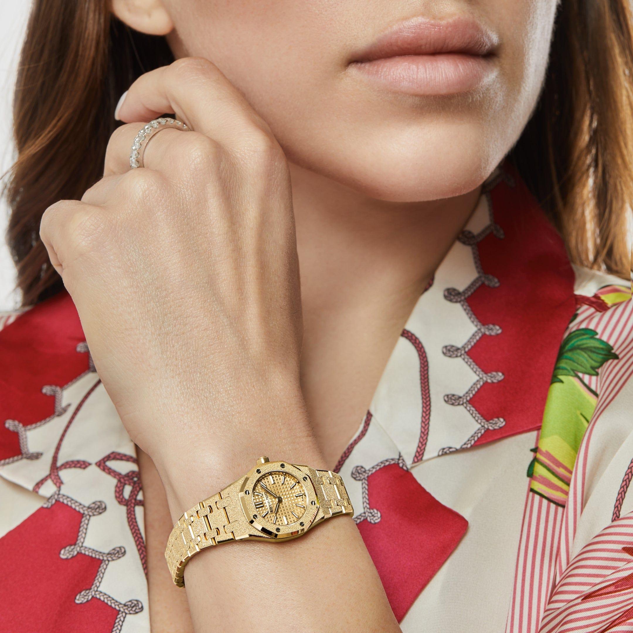 Jewels Aficionado presents an Inspired by the Mini Oak released in the late '90s and in tribute to the women who have shaped the company's history, Audemars Piguet unveils the Royal Oak 'Mini'. The delicate 23mm case is crafted in frosted yellow