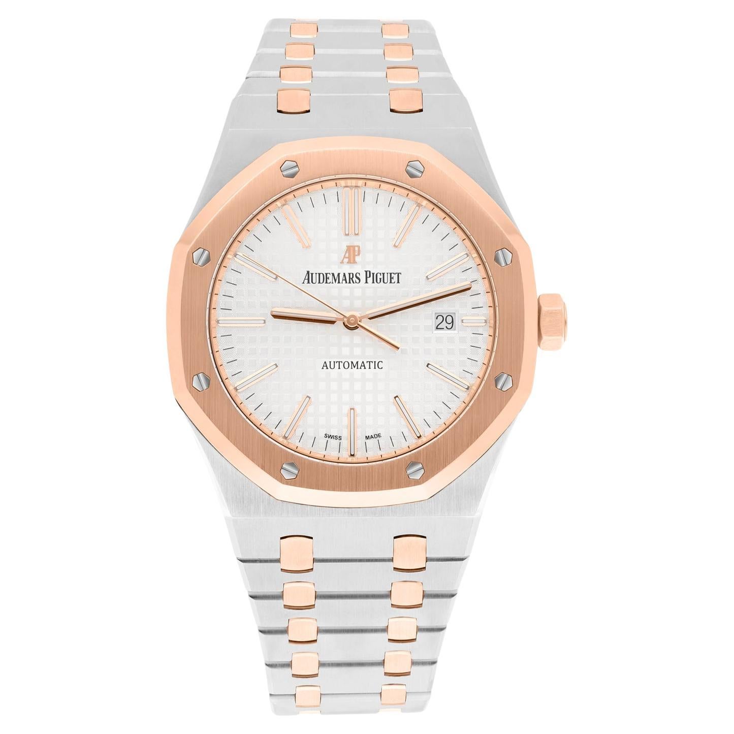Stainless steel case with a stainless steel bracelet with 18kt rose gold links. Fixed 18kt rose gold bezel. Silver dial with rose gold-tone hands and index hour markers. Minute markers around the outer rim. Dial Type: Analog. Luminescent hands and