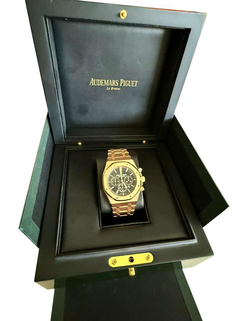 Audemars Piguet Royal Oak Rose Gold Black Dial Mens Watch 26320OR. Automatic self-winding chronograph movement. 18k rose gold octagonal case, 41 mm in diameter. 18k rose gold screw down crown and two pushers. Solid case back. 18k rose gold bezel