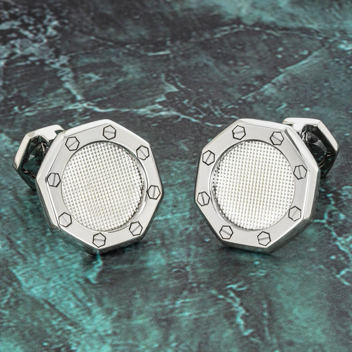 A pair of 18k white gold Royal Oak cufflinks by Audemars Piguet. The cufflinks feature a waffle design centre with the iconic Audemars Piguet screw design on the outer edge. Each cufflink has a diameter of 18.5mm. The cufflinks feature t-bar