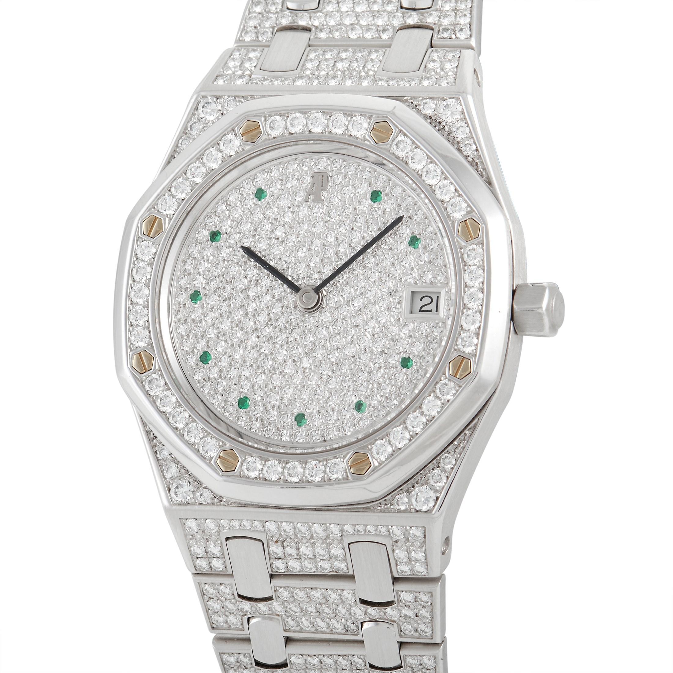 The Audemars Piguet Royal Oak Diamond and Emerald Watch, reference number 14844BC, is a spectacular timepiece that exudes undeniable luxury. 

This breathtaking timepiece is made from 18K white gold and accented by glittering diamonds on the 37mm
