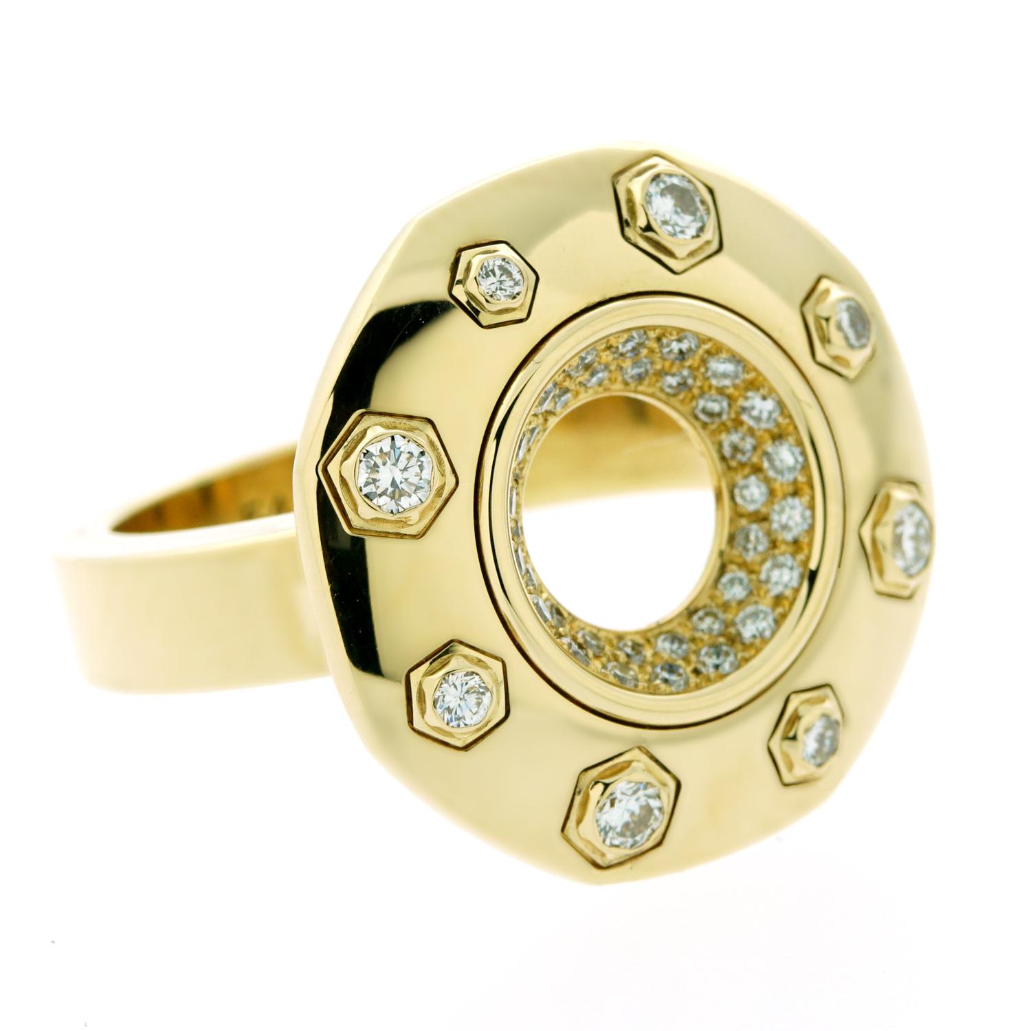 An opulent ring from Audemars Piguet's Royal Oak collection. Set in 18k yellow gold, this ring features Vvs clarity E-F color round brilliant cut diamonds. With eight diamonds set on the outer edge and 36 additional diamonds in the center, you're