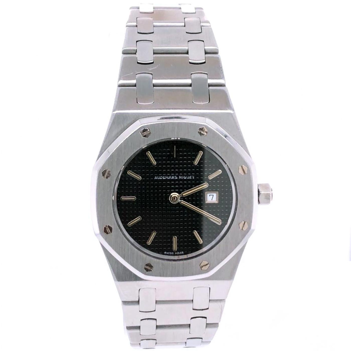 Silver-tone stainless steel case and bracelet. Fixed silver-tone stainless steel bezel. Blue dial with silver-tone hands and index hour markers. Minute markers around the outer rim. Dial Type: Analog. Luminescent hands and markers. The date is