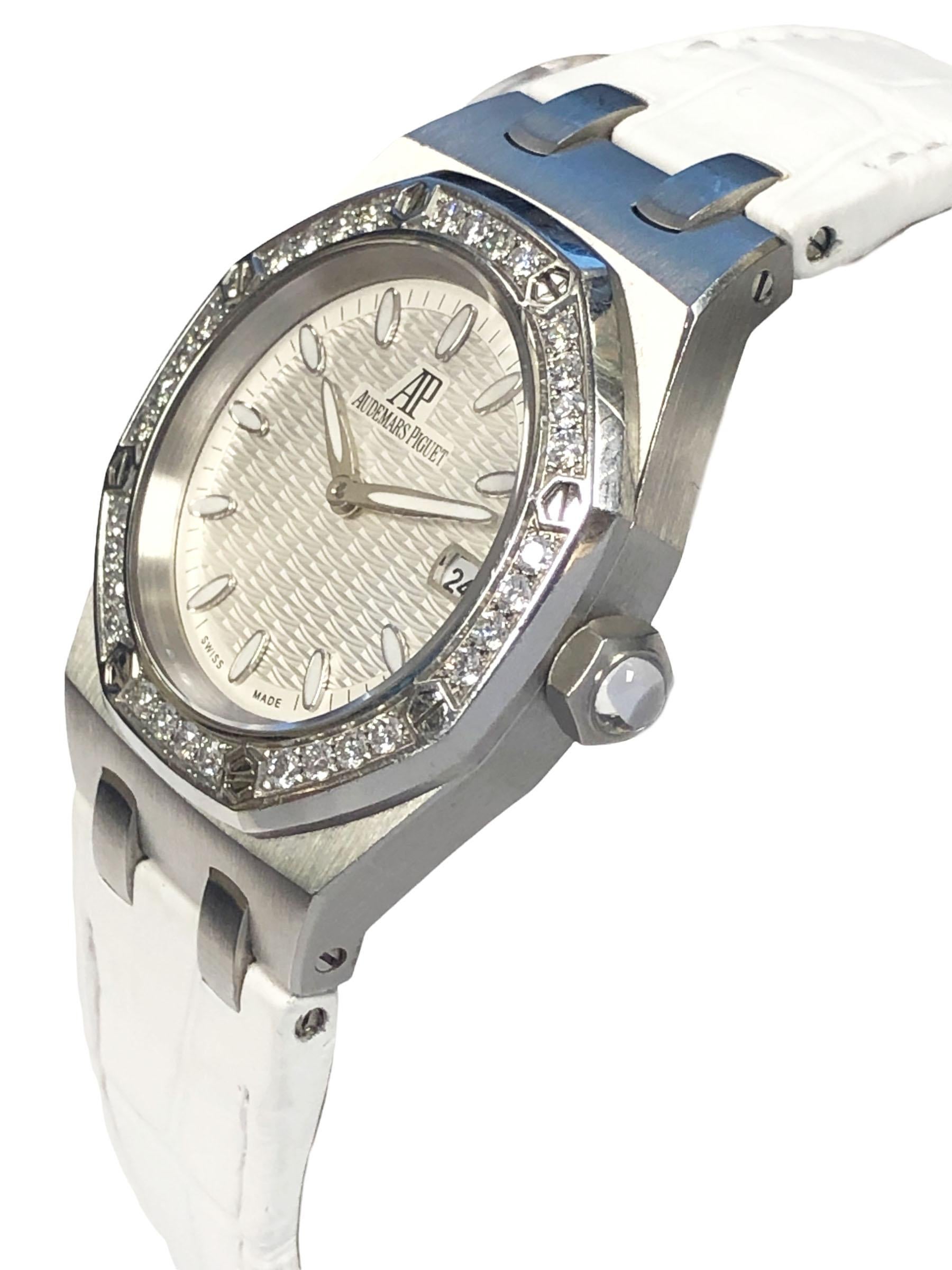 Circa 2004 Audemars Piguet Royal Oak, Ladies Reference 67601st Wrist Watch, 33 M.M. Stainless Steel water resistant 2 piece  case with a bezel of 32 Round Brilliant cut Diamonds, caliber 2712 Quartz Movement, Silver wave dial with raised markers and