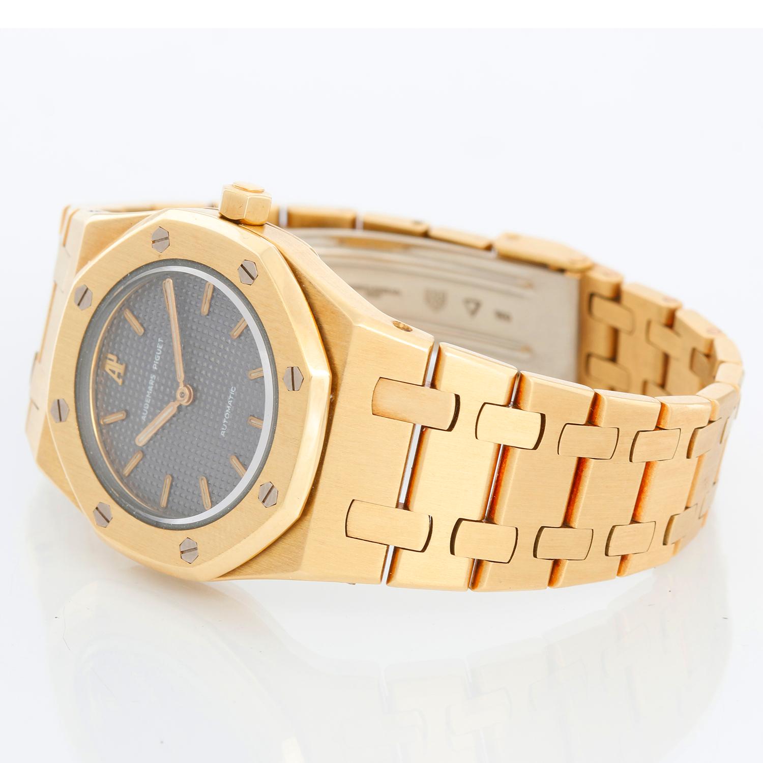 Audemars Piguet Royal Oak Ladies Automatic Watch Yellow Gold - Automatic winding. Yellow Gold case (29mm diameter). Grey waffle dial with stick markers. Yellow Gold Royal Oak bracelet. Pre-owned with Audemars Piguet box. Very rare automatic movement