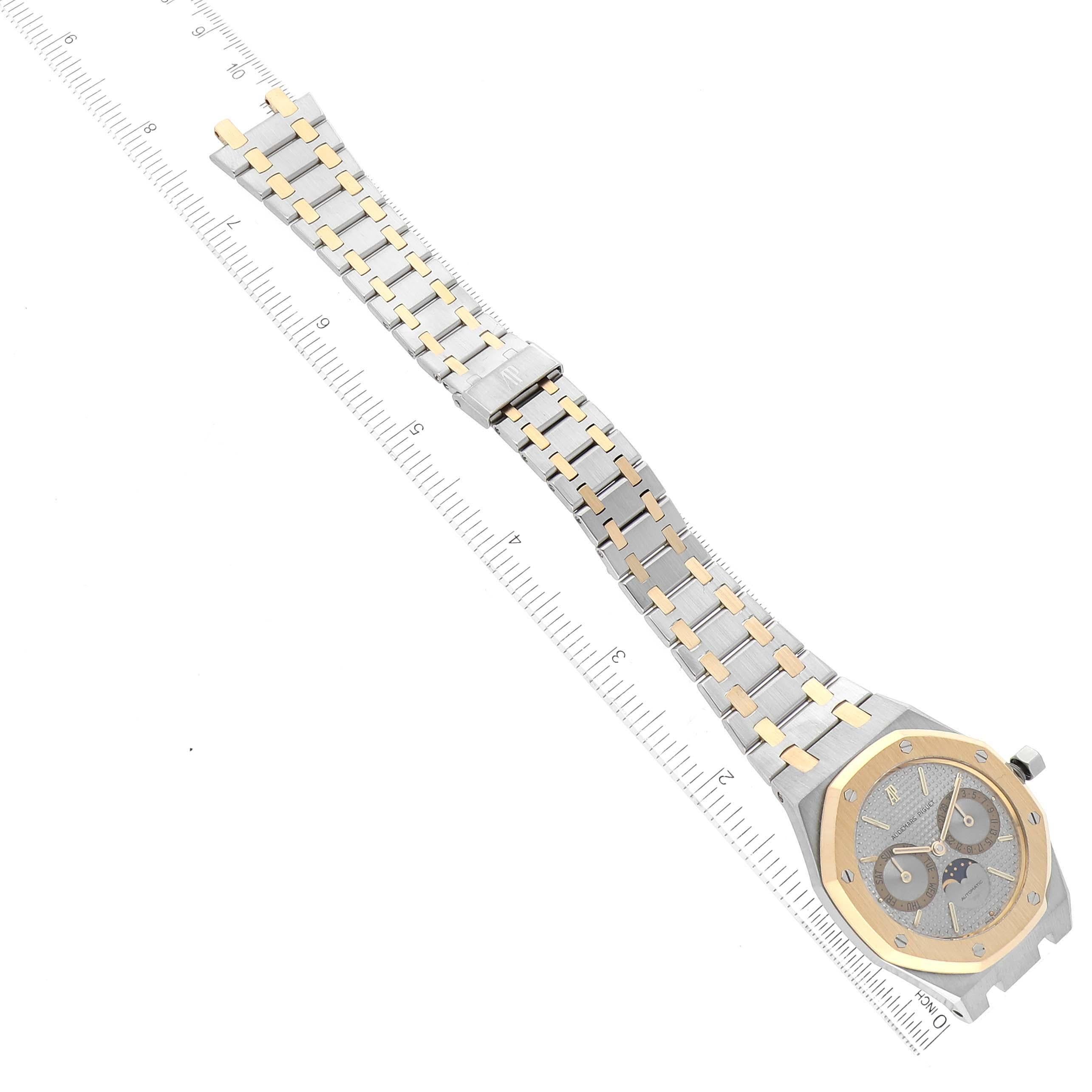 Audemars Piguet Royal Oak Moonphase Steel Yellow Gold Mens Watch 25594SA. Automatic self-winding movement. Brushed stainless steel and 18K yellow gold case 36.0 mm in diameter. 18K yellow gold bezel punctuated with 8 signature screws. Scratch