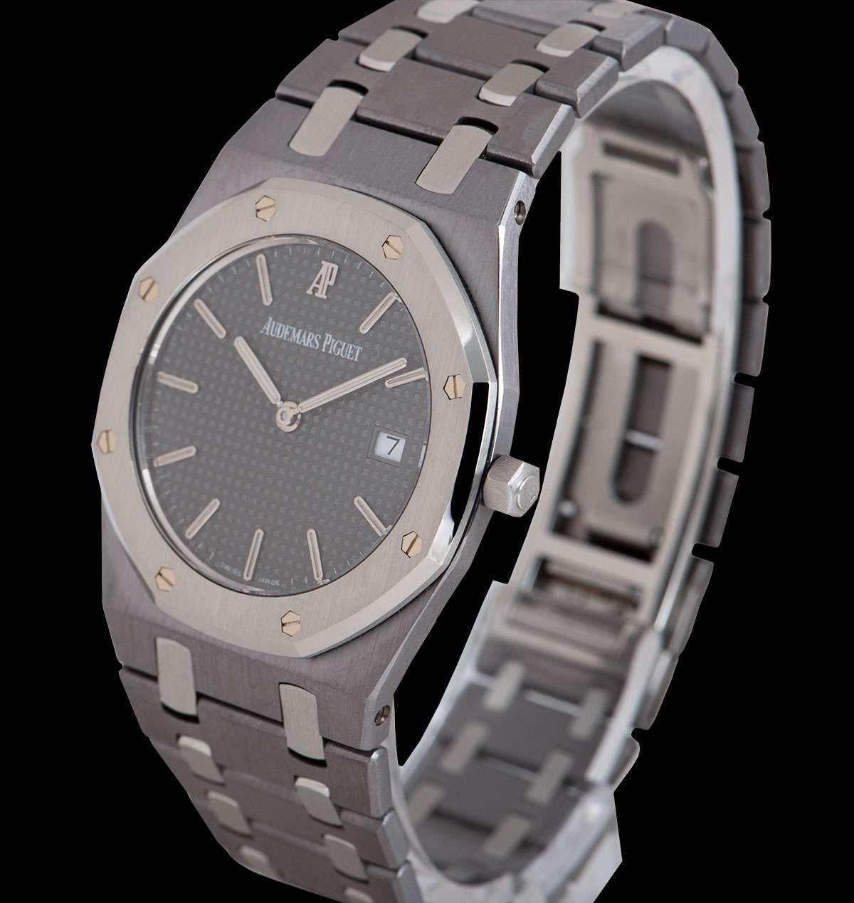 A Limited Edition Tantalum & Stainless Steel Royal Oak Championship Nick Faldo 33mm Wristwatch 56175TT.OO.0789TT.01, grey dial with applied hour markers, date at 3 0'clock, a fixed stainless steel bezel with 8 iconic Audemars Piguet screws, a