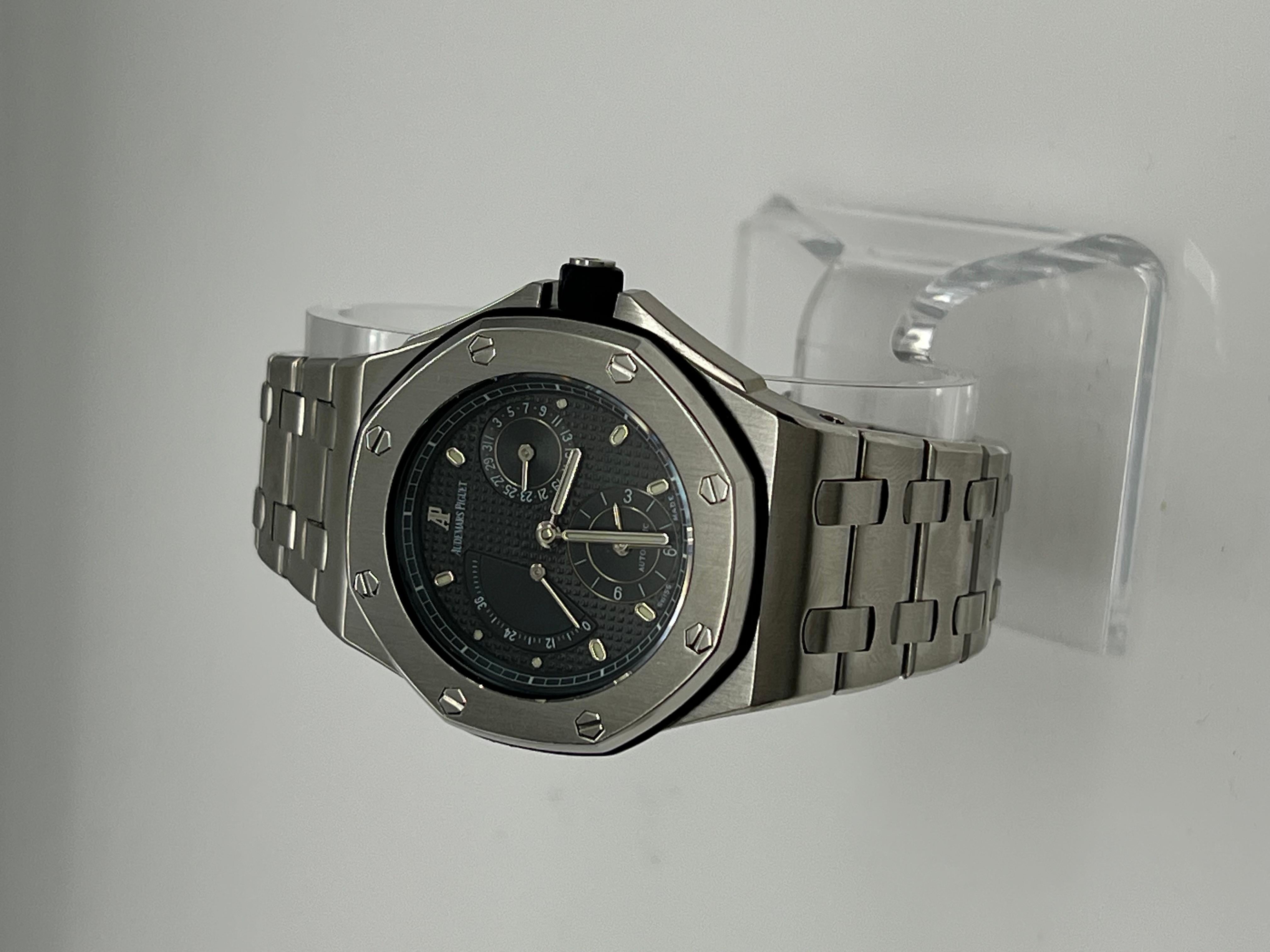 Style Number: 25970ST
Year: Est. 1997
Model: Royal Oak Offshore - Hong Kong Edition 
Case Material: Stainless Steel 
Band: Stainless Steel 
Bezel:  Stainless Steel 
Dial: Blue
Face: Sapphire Crystal 
Case Size: 38mm 
Includes: 
-Elegant Watch