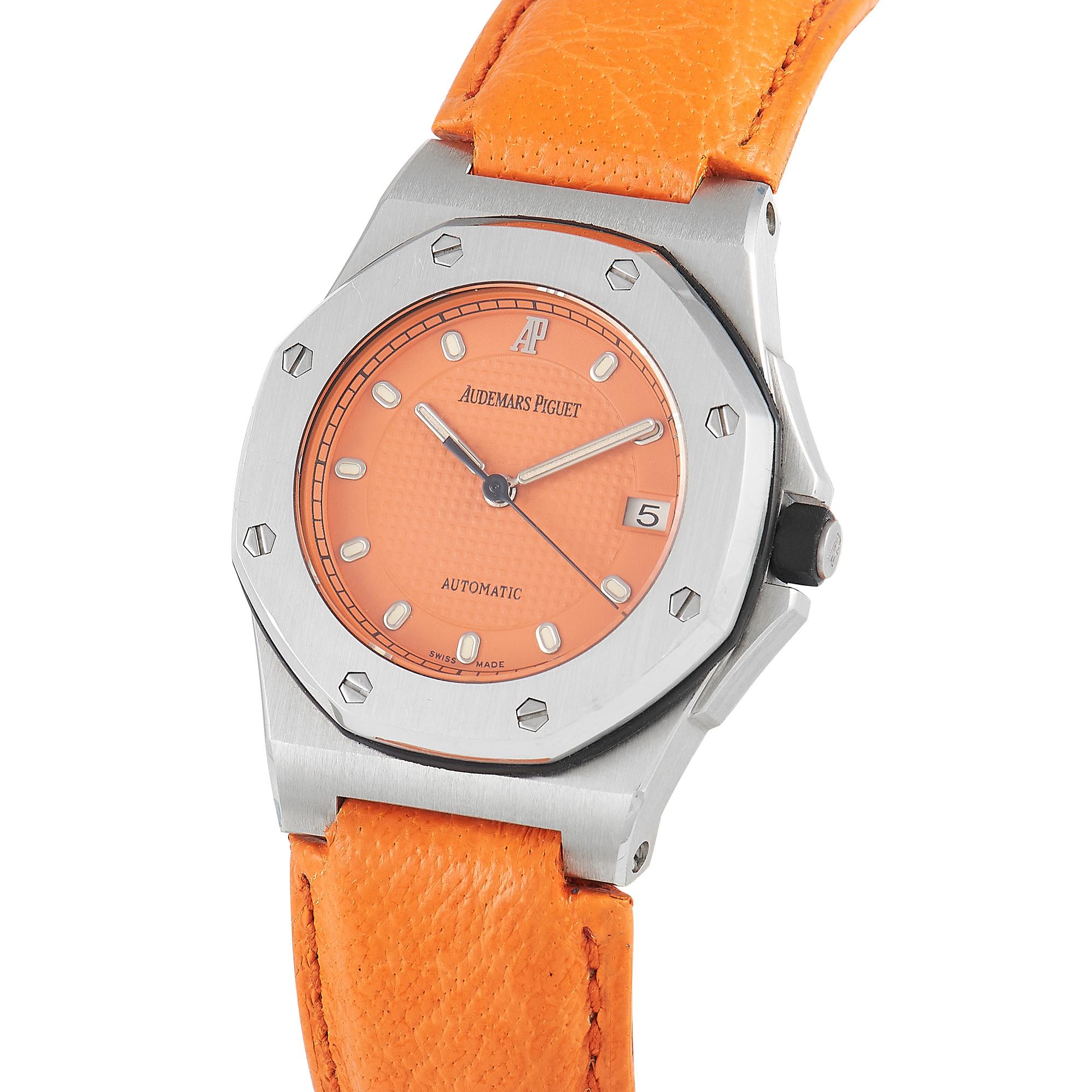 What's particularly delightful about this Audemars Piguet Royal Oak Offshore Ladies Watch is its bold yet still classy design.  On a mid-sized steel case is an orange dial that matches the color of the leather strap. The central portion bears a